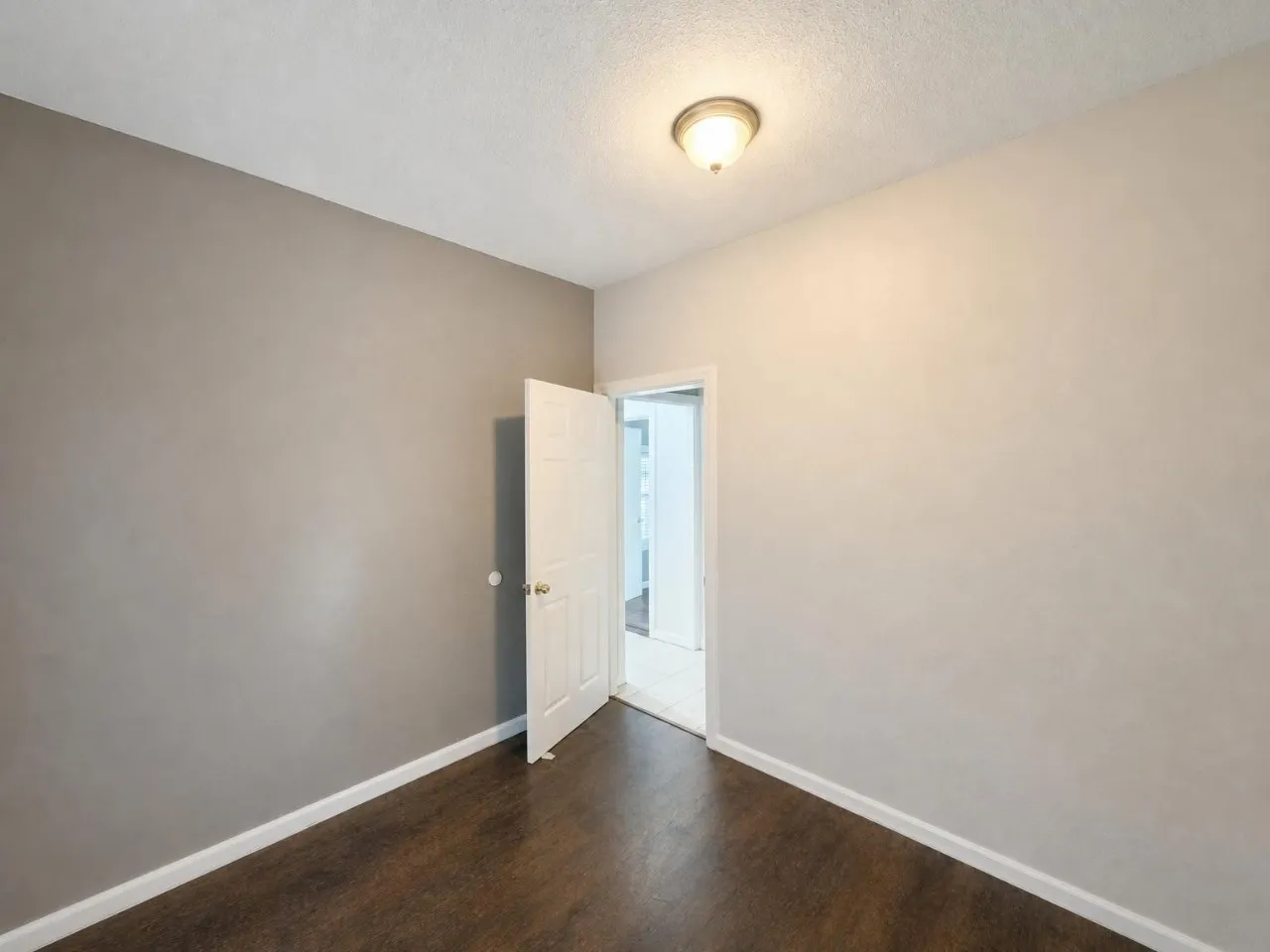 Wood-finish flooring with crisp white trim