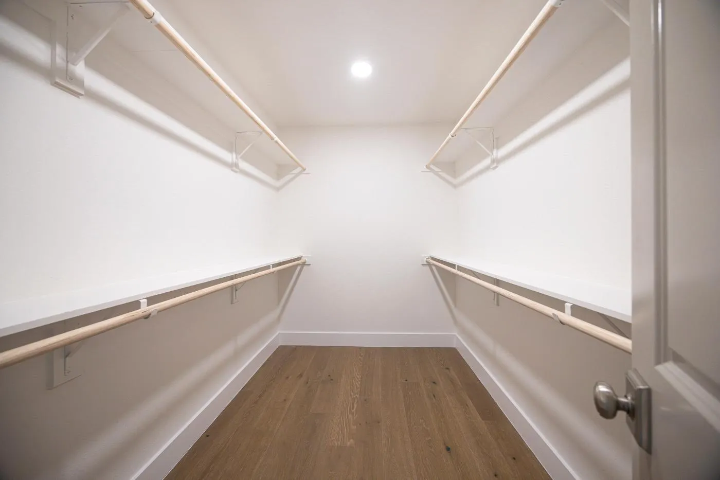 Primary bedroom walk-in closet