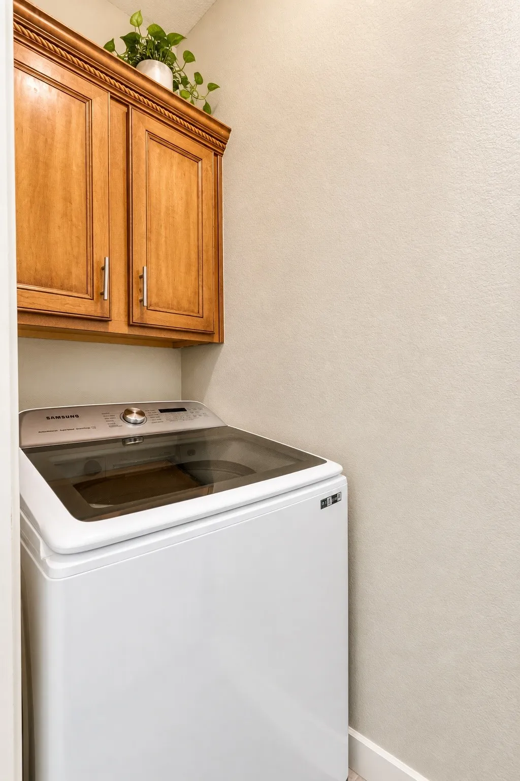 Built-in wood cabinetry with decorative molding and brushed nickel hardware