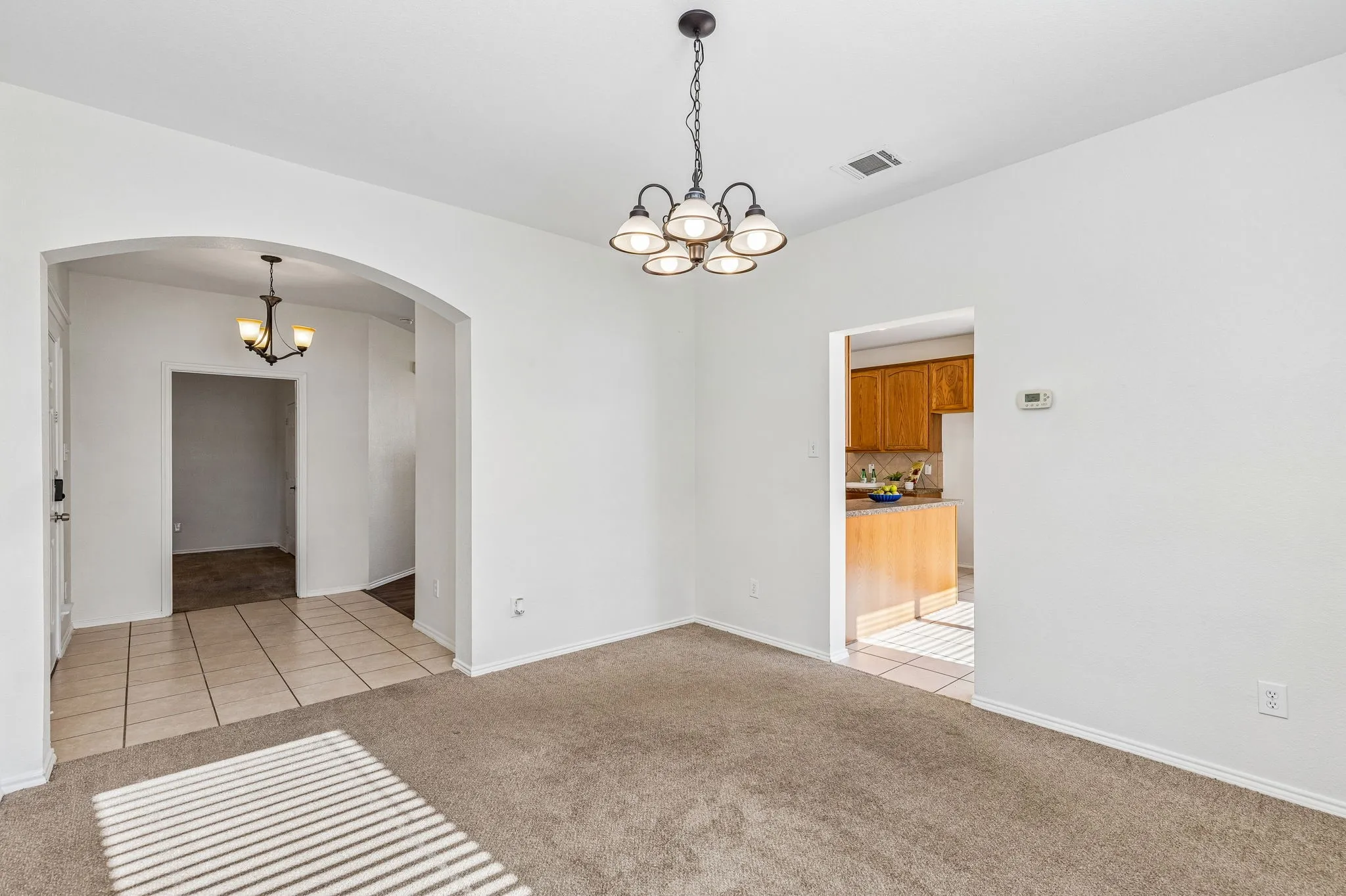 Natural light fills the dining room while maintaining an effortless flow to the kitchen and living spaces.
