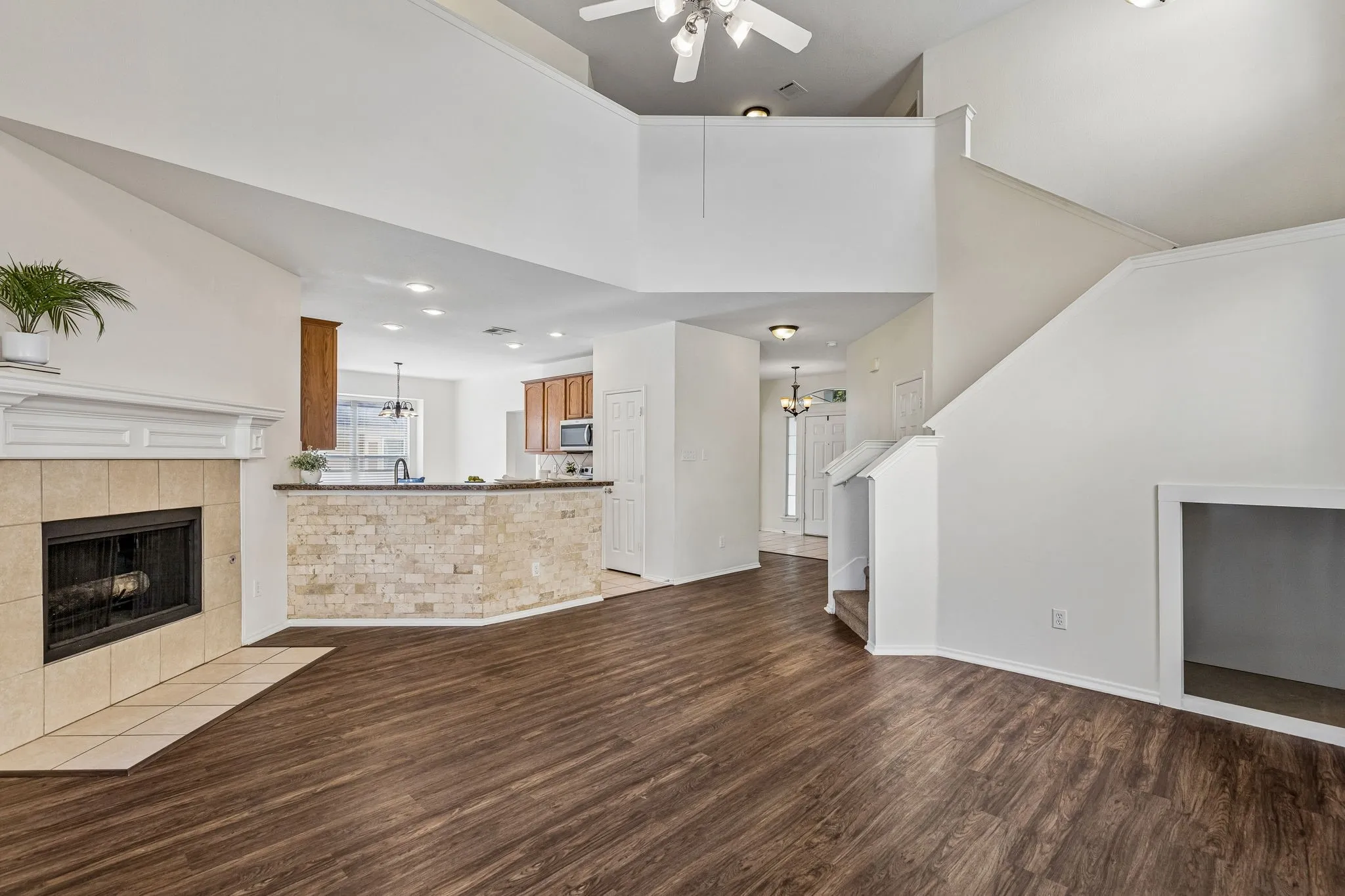 Soaring two-story ceilings, abundant natural light and a cozy gas fireplace create a stunning family room centerpiece.
