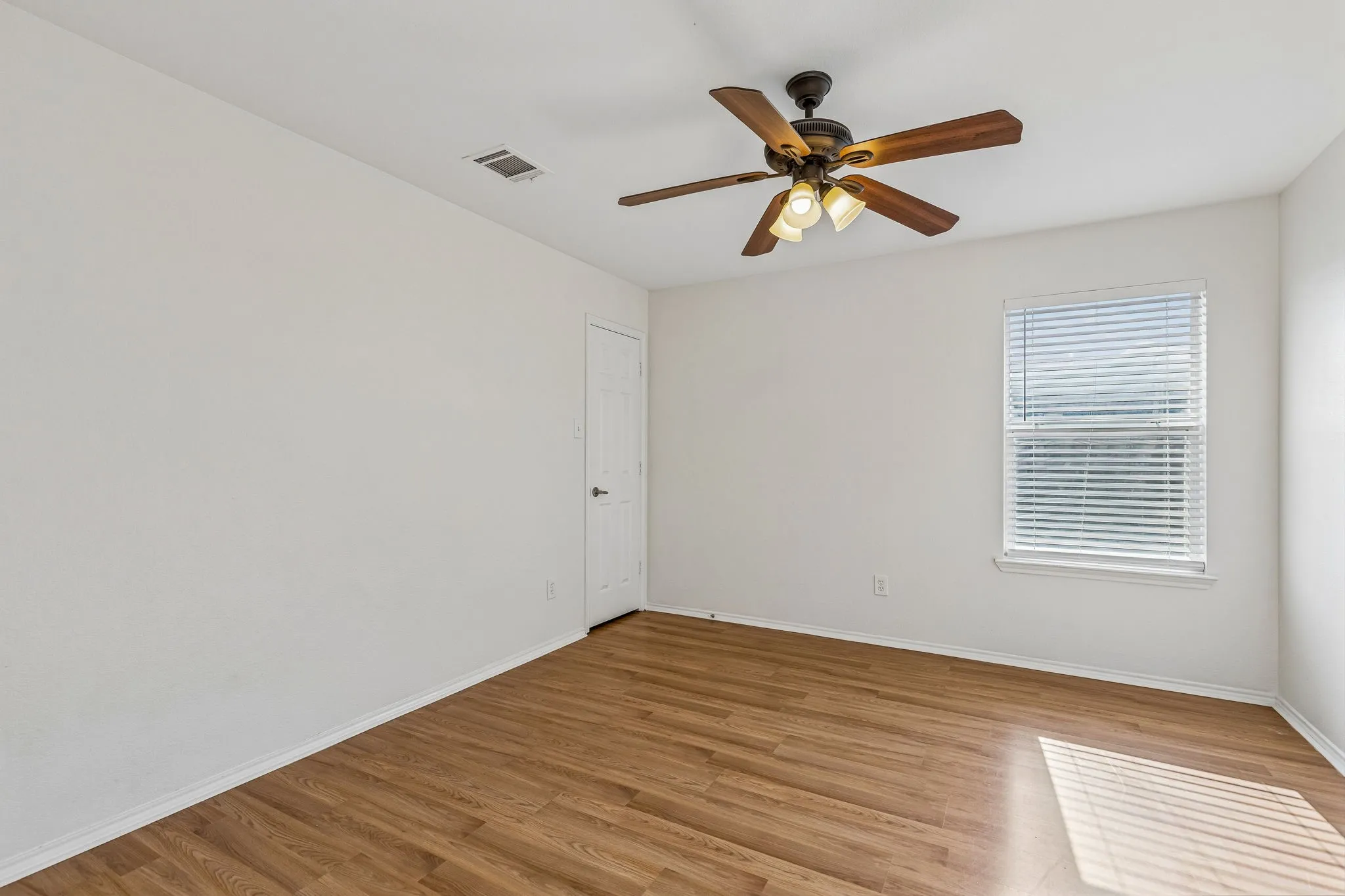 This comfortable secondary bedroom provides flexible space for family, guests or hobbies.