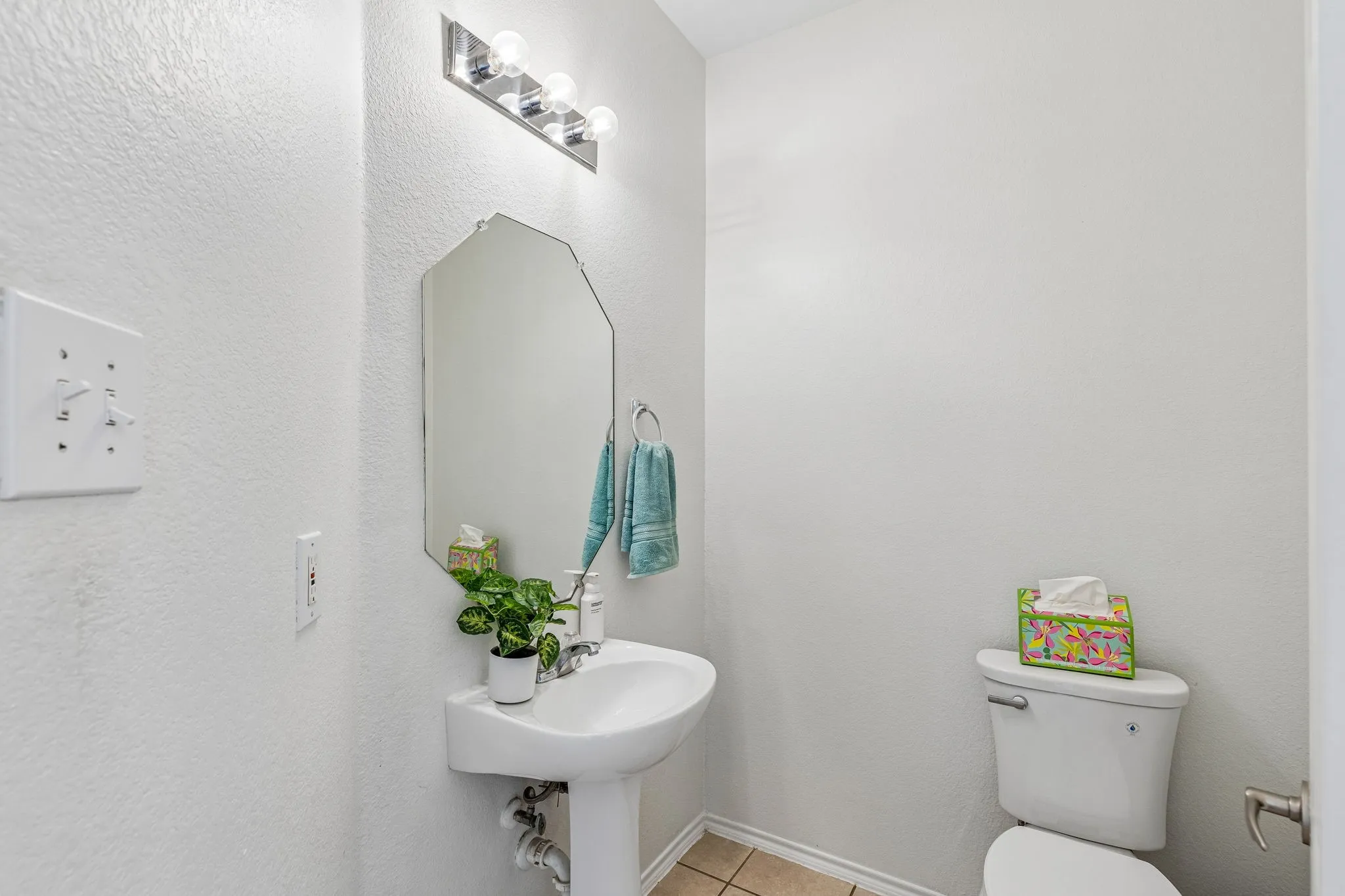 Convenient first-floor powder bath perfectly positioned for guests and everyday living.