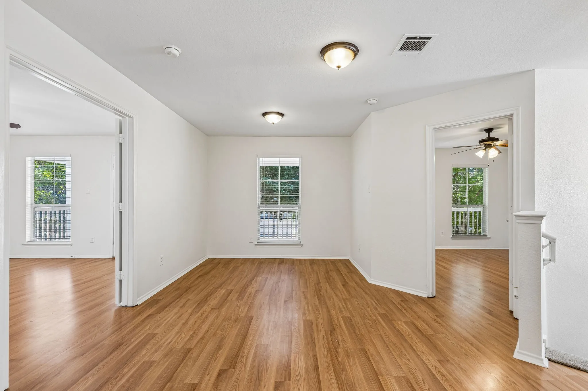 The upstairs loft overlooks the family room and creates the perfect game room, media room or homework space.