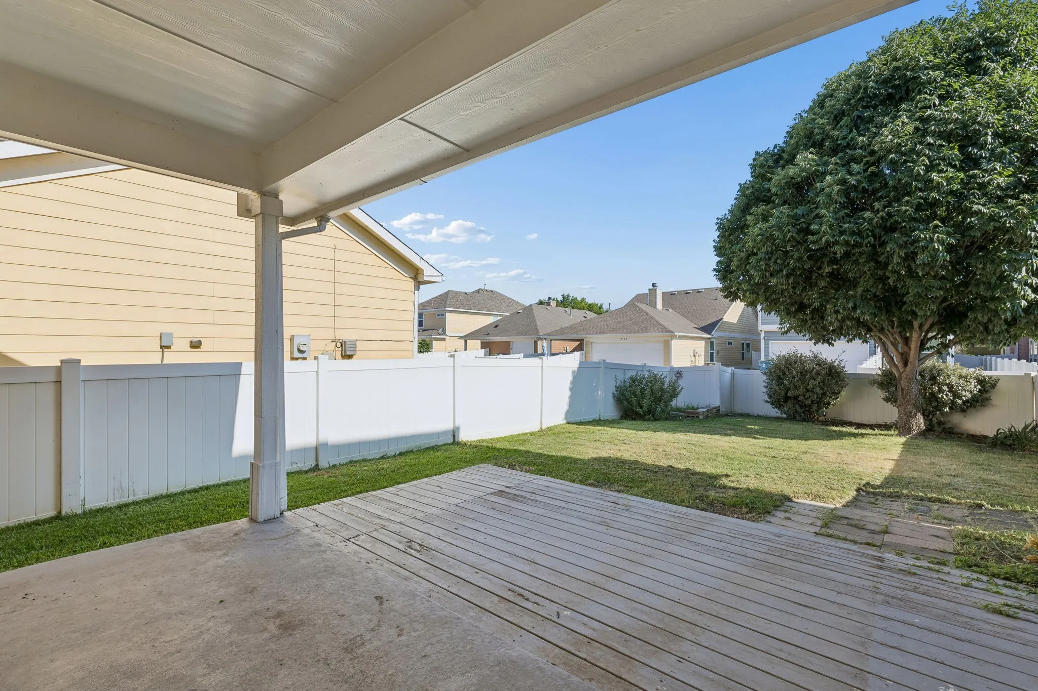 A covered patio and extended deck provide plenty of room for outdoor dining, grilling and entertaining.