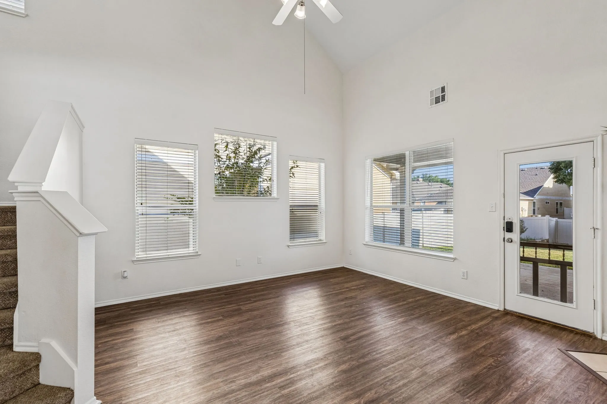 Open sightlines and dramatic ceiling height make the family room ideal for relaxing and entertaining.