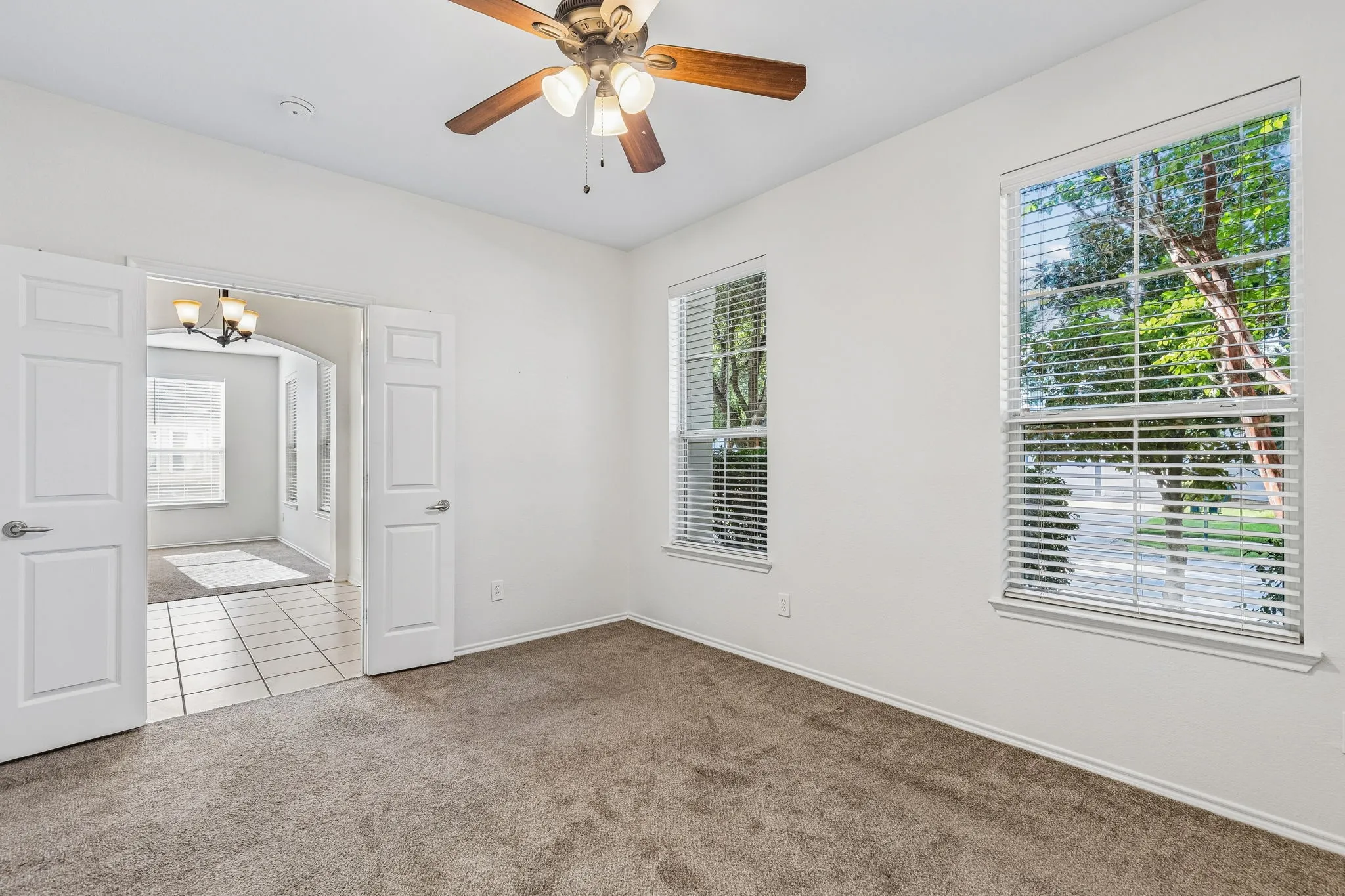 French doors provide privacy and flexibility, making this spacious flex room ideal for working from home or accommodating overnight guests.