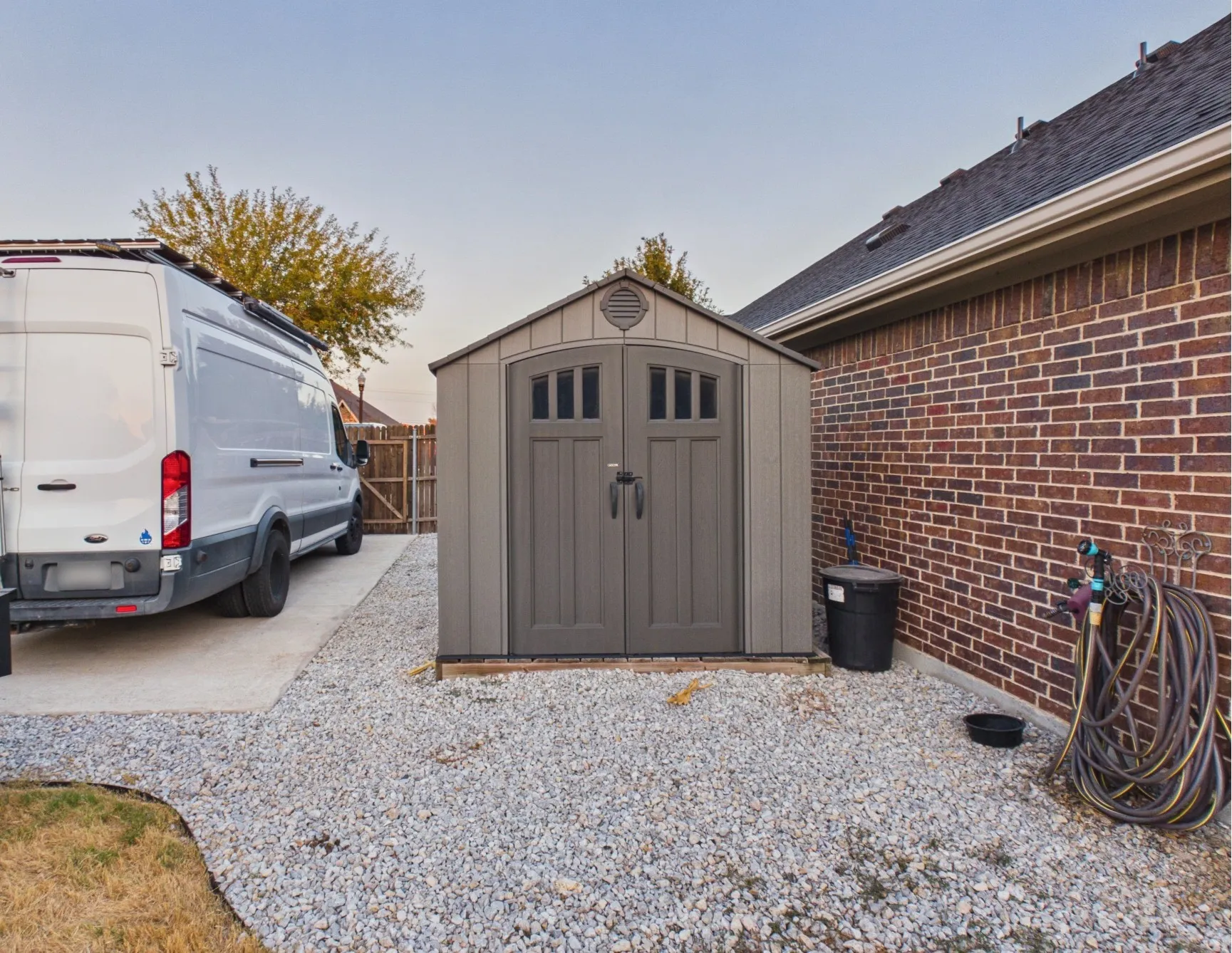 Shed to remain, parking pad added