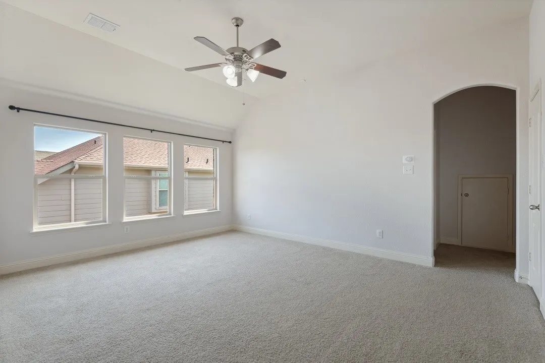 Vaulted ceiling with an attached ceiling huge game room upstairs with ceiling fan, media room straight to the back, plus a full bathroom to the left