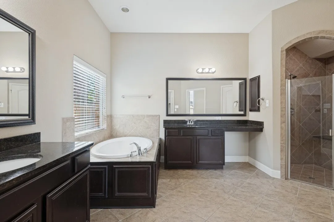 - Double vanities
- Oversized tub
- Walk-in shower
- Oversized mirrors and light fixtures