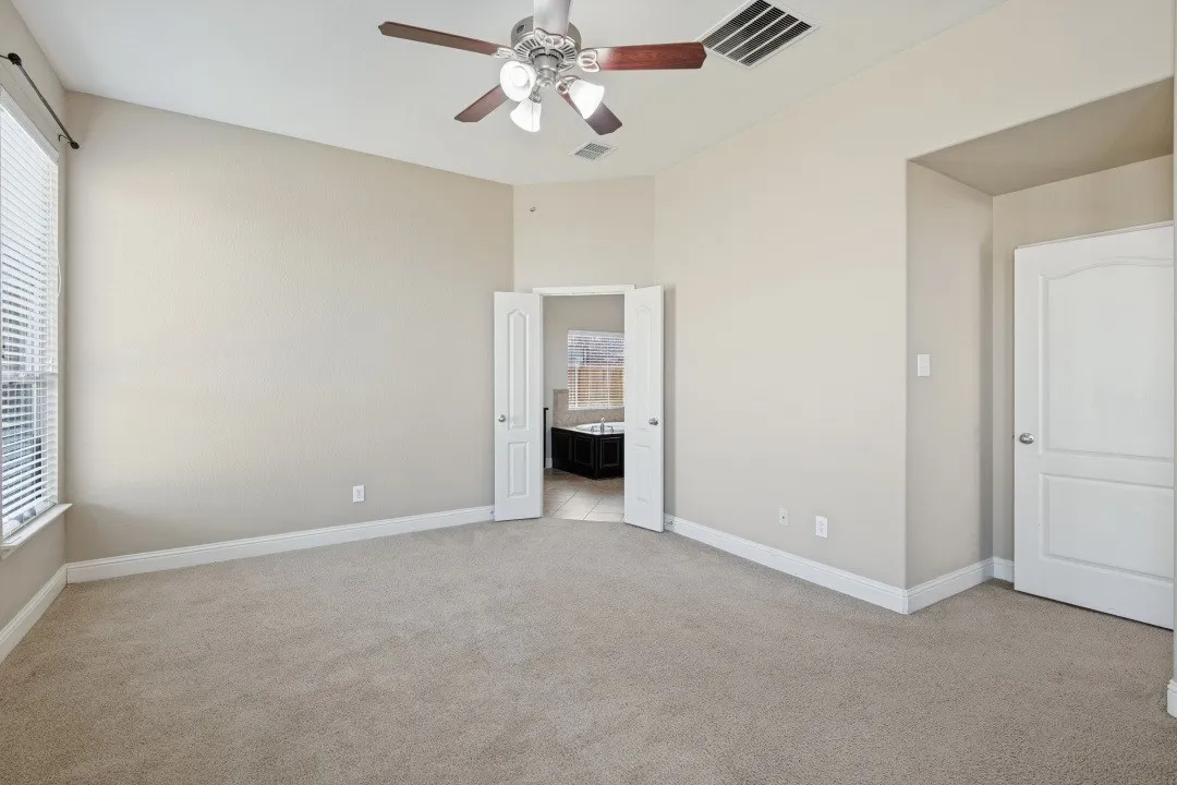 This is the primary bedroom, oversized with plenty of room for your biggest furniture, going into the oversized master bathroom
