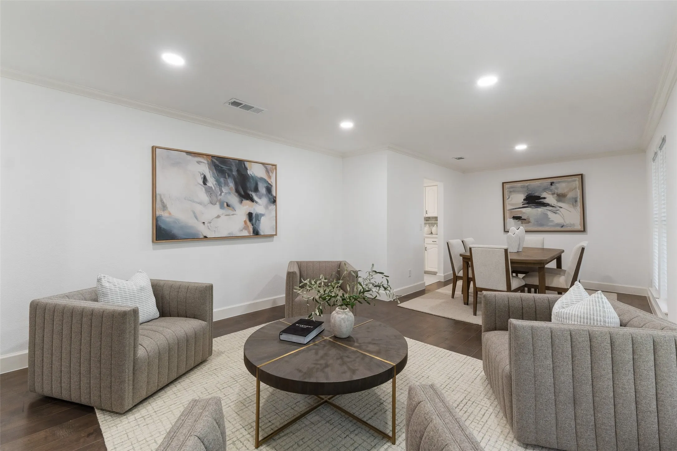 Recessed lighting, crown molding, and wood-finish flooring