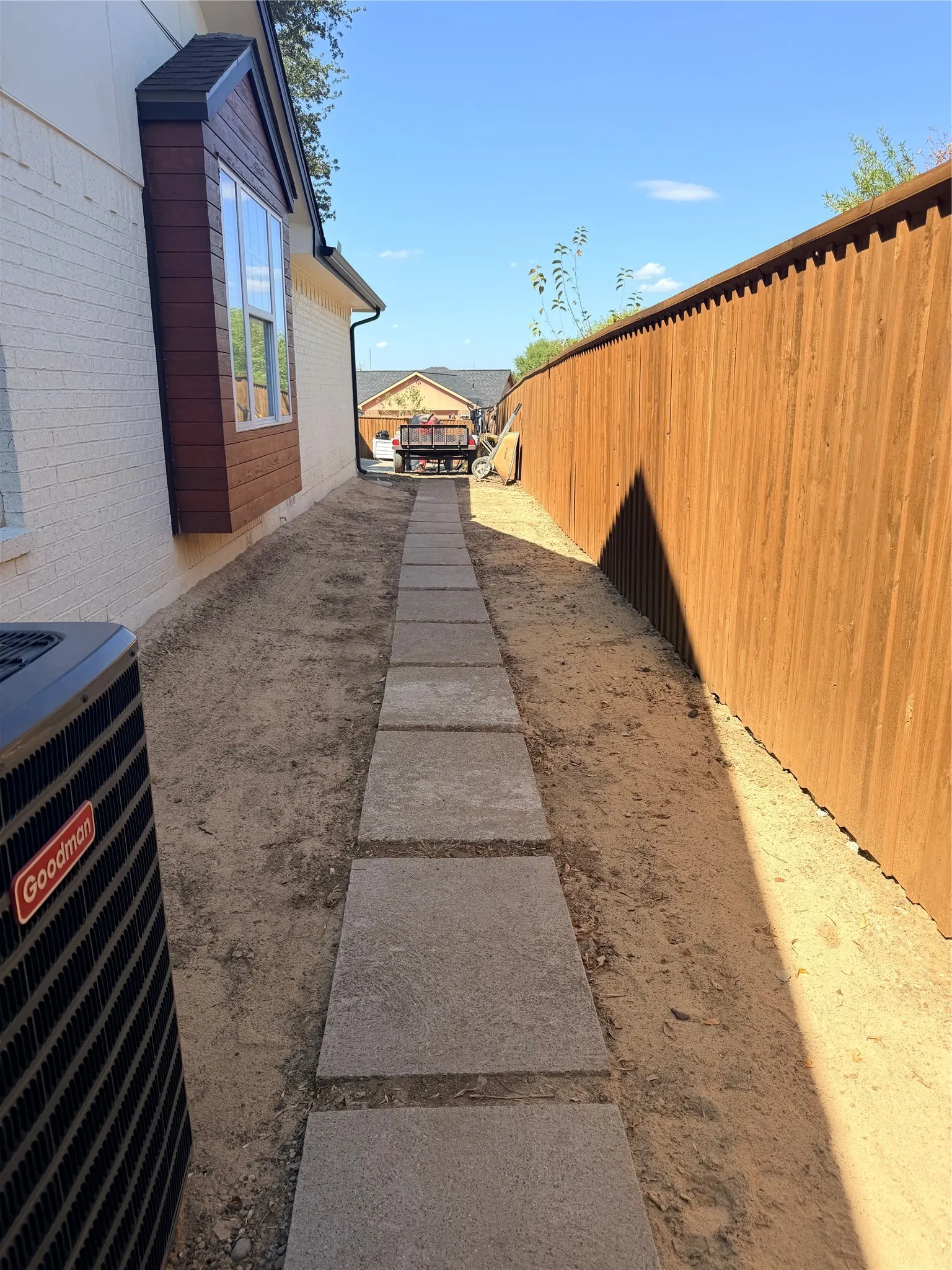 right side of home stone walkway near AC