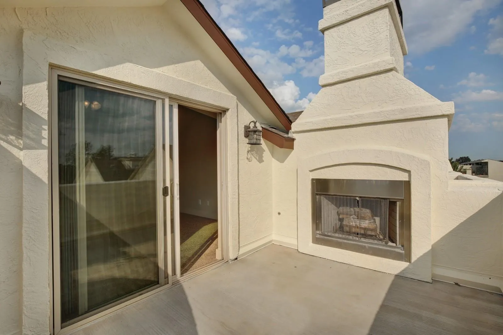 Outdoor fireplace with a stainless steel firebox