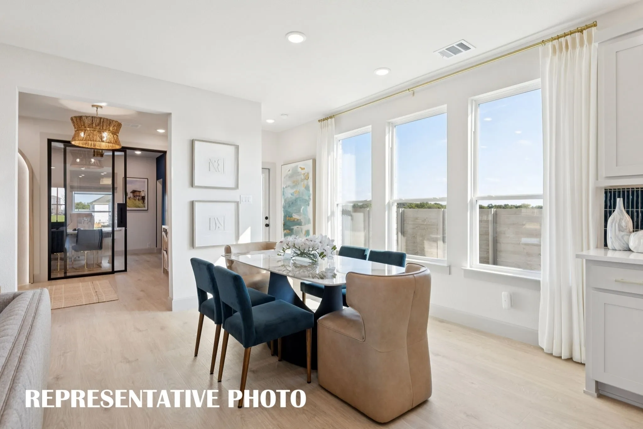 Whether it's lively dinner parties or cozy family meals, this dining room fits all occasions!  REPRESENTATIVE PHOTO