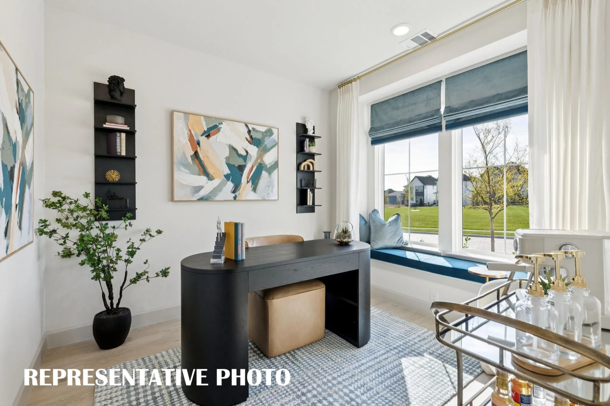 The light bright home office in our Bella II plan is the perfect space for the professional who needs to work from home.  REPRESENTATIVE PHOTO
