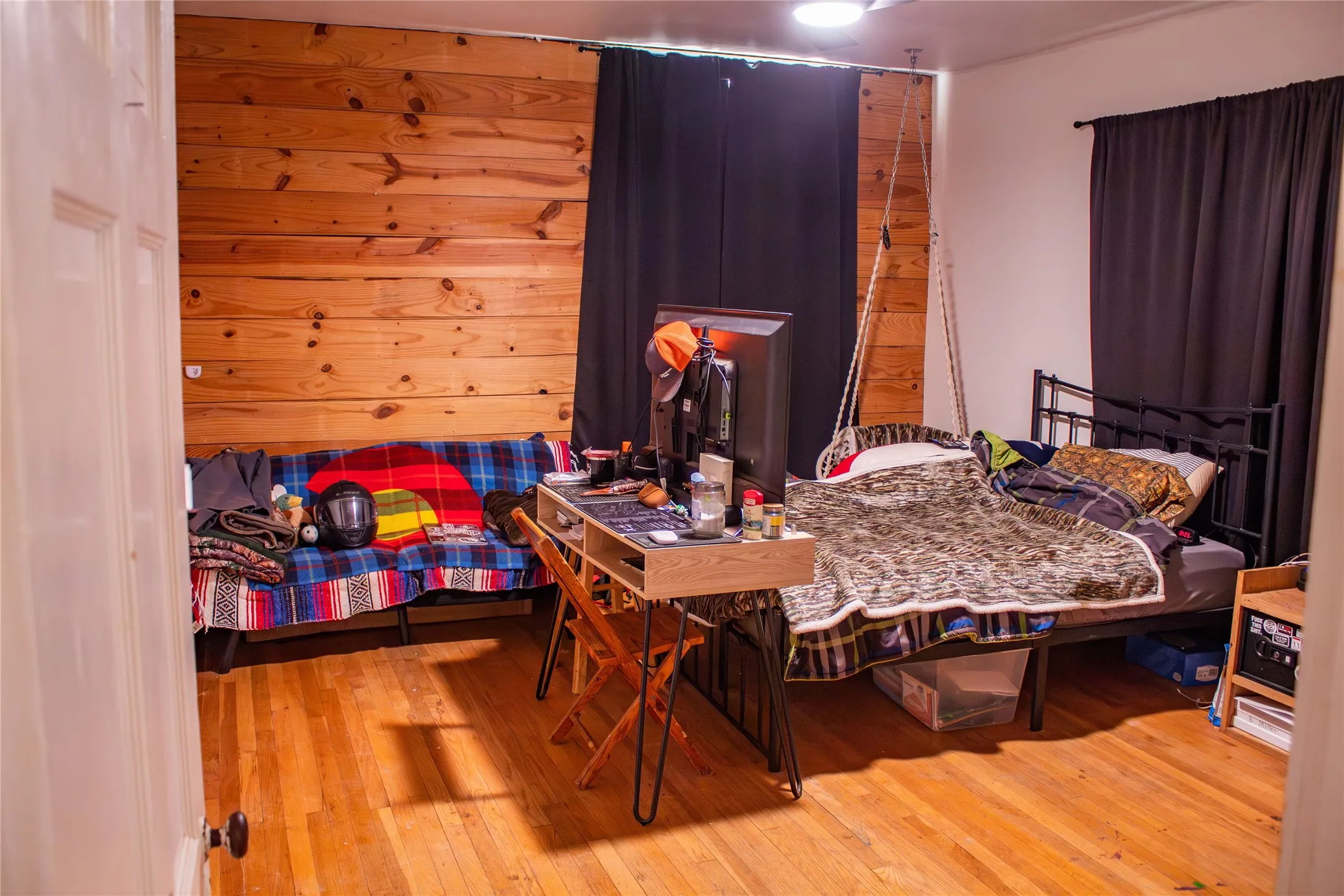 Wood-finish flooring with a horizontal wood panel accent wall