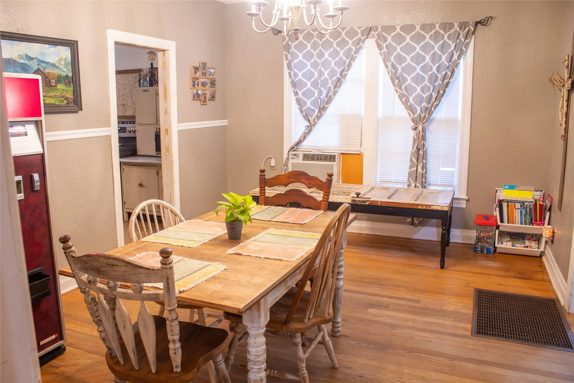 Wood-finish flooring throughout, complemented by a chair rail and crown molding