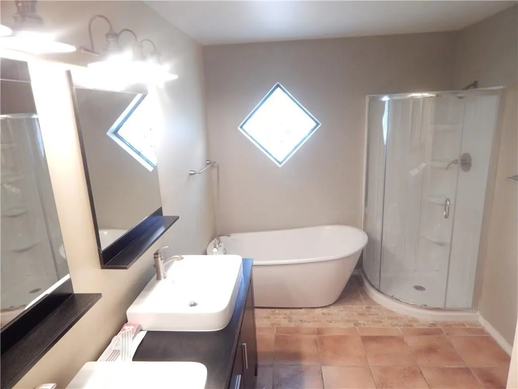 Secondary Bathroom. Tub, Shower and Dual Vanity