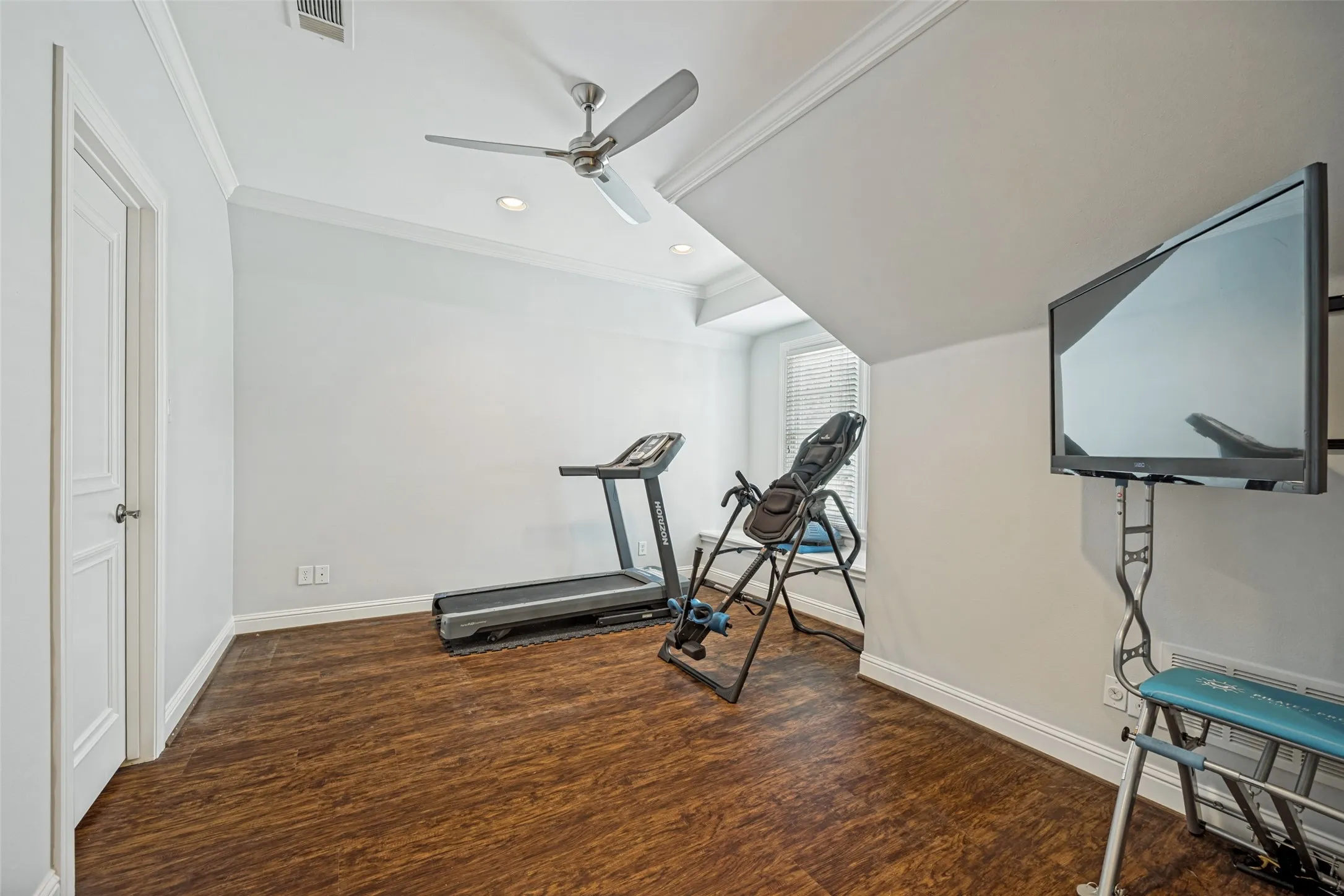Third floor fifth bedroom currently used as a workout room