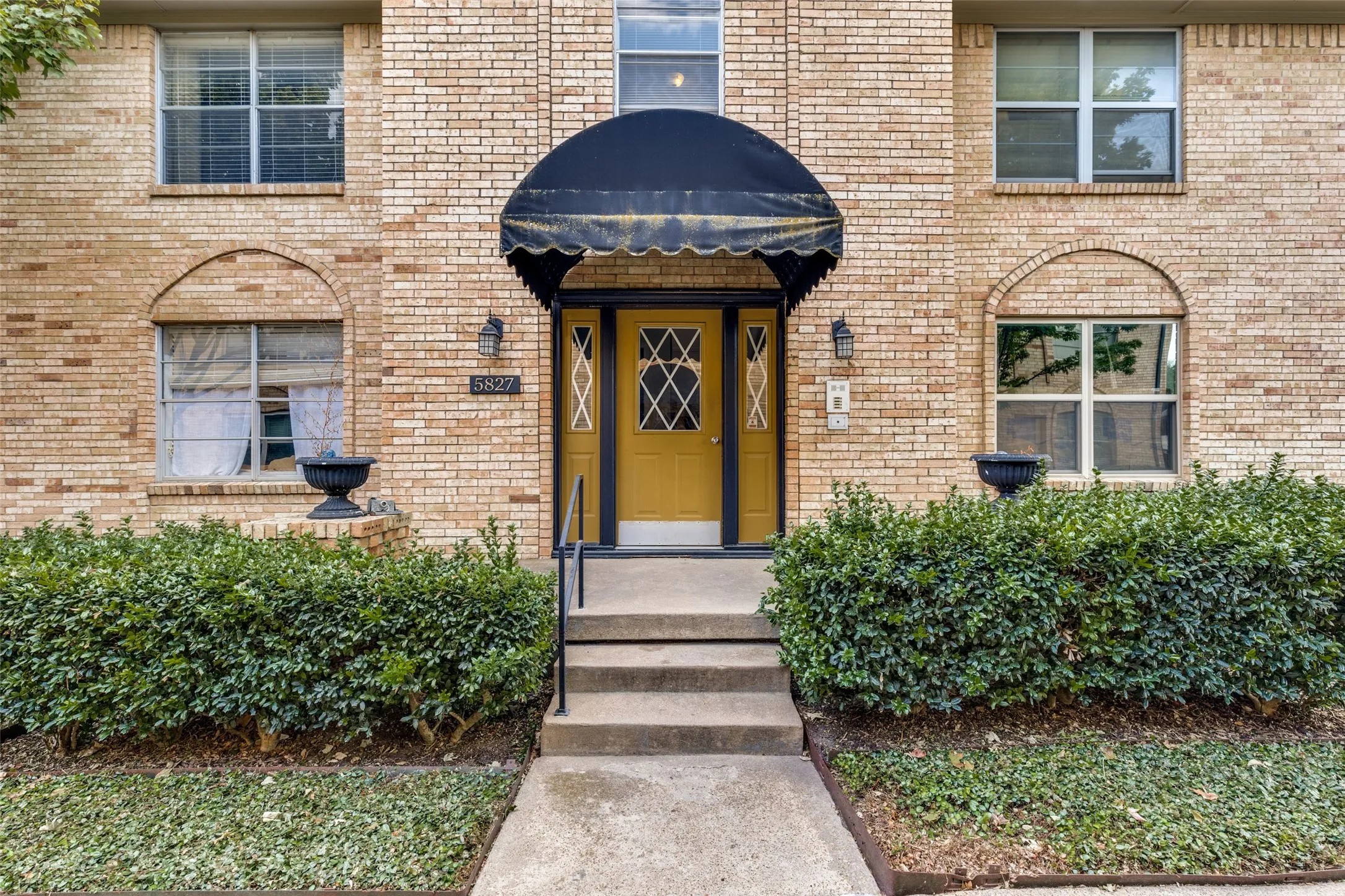 Brick exterior with arched window detailing