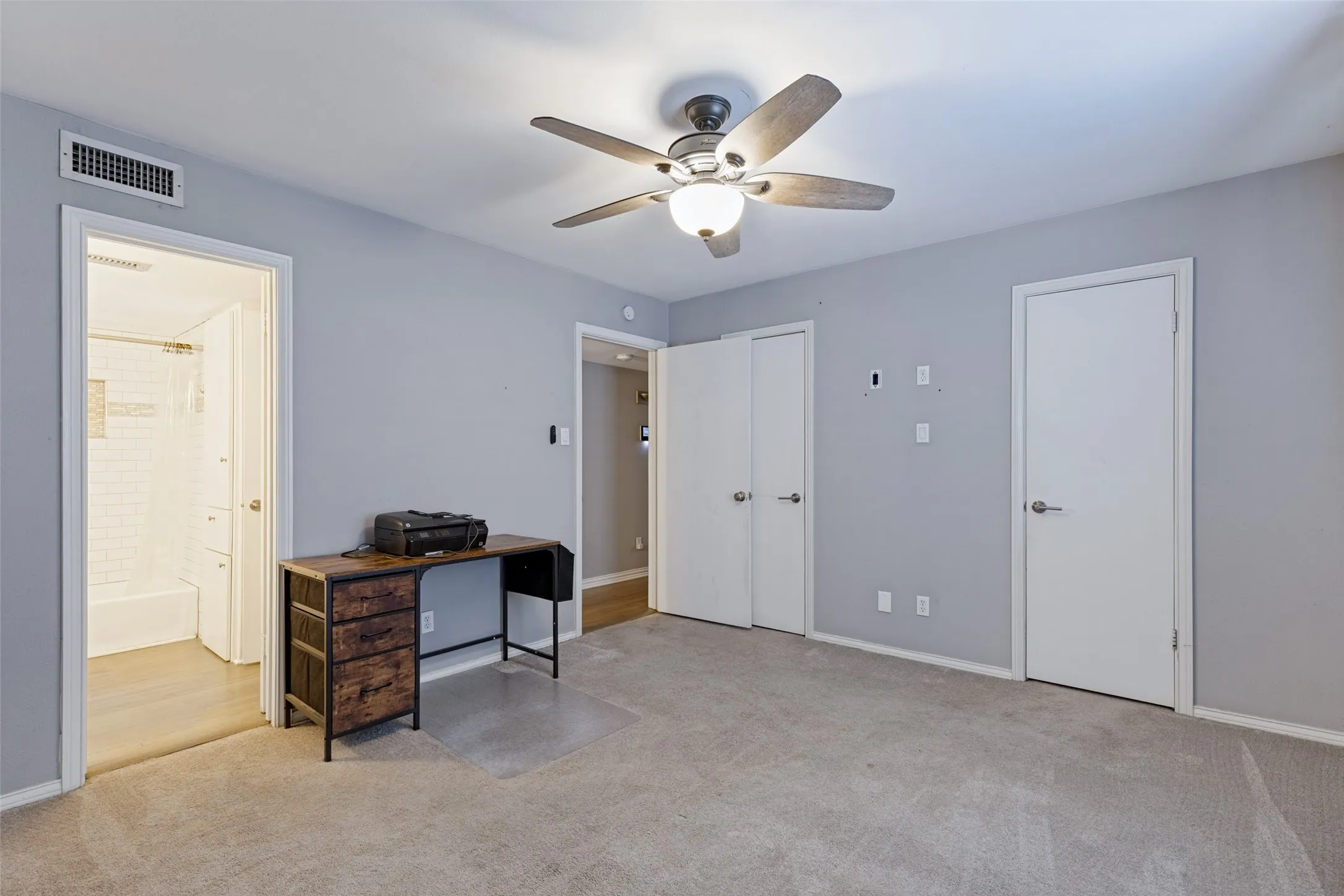 Recessed lighting, ceiling fan with integrated light, light gray walls, white trim, and white doors