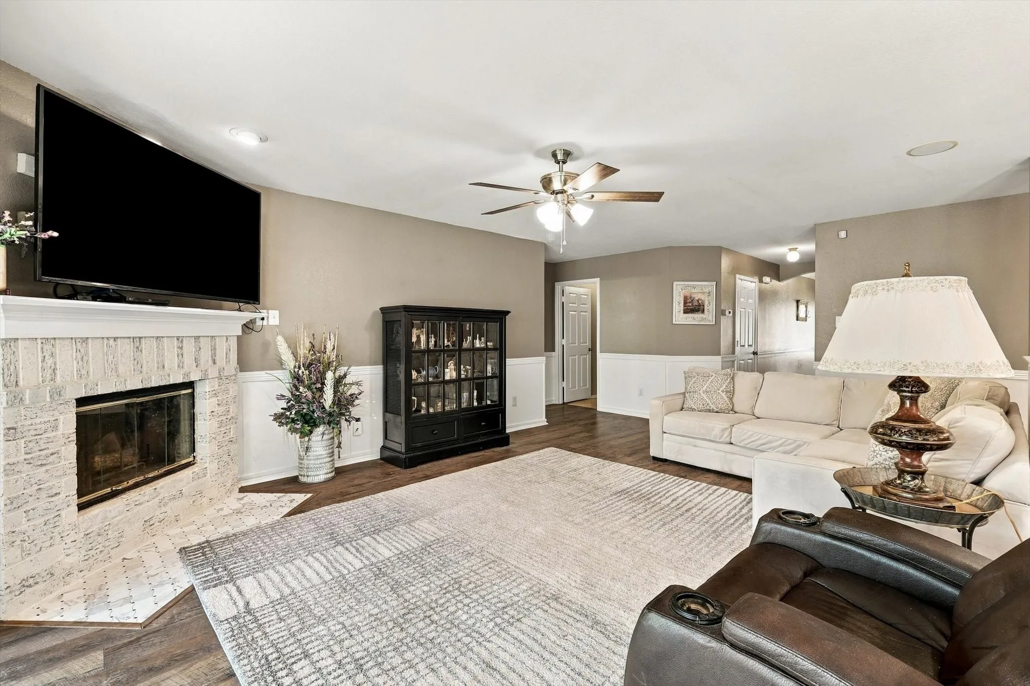 Fireplace with decorative tile and mantle.
