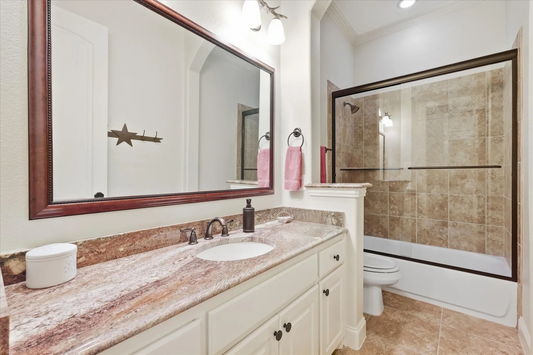 Vanity with a single undermount sink and stone countertop