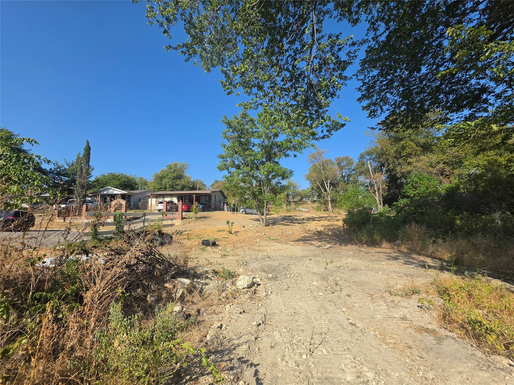 Expansive land lot with established trees and natural landscaping