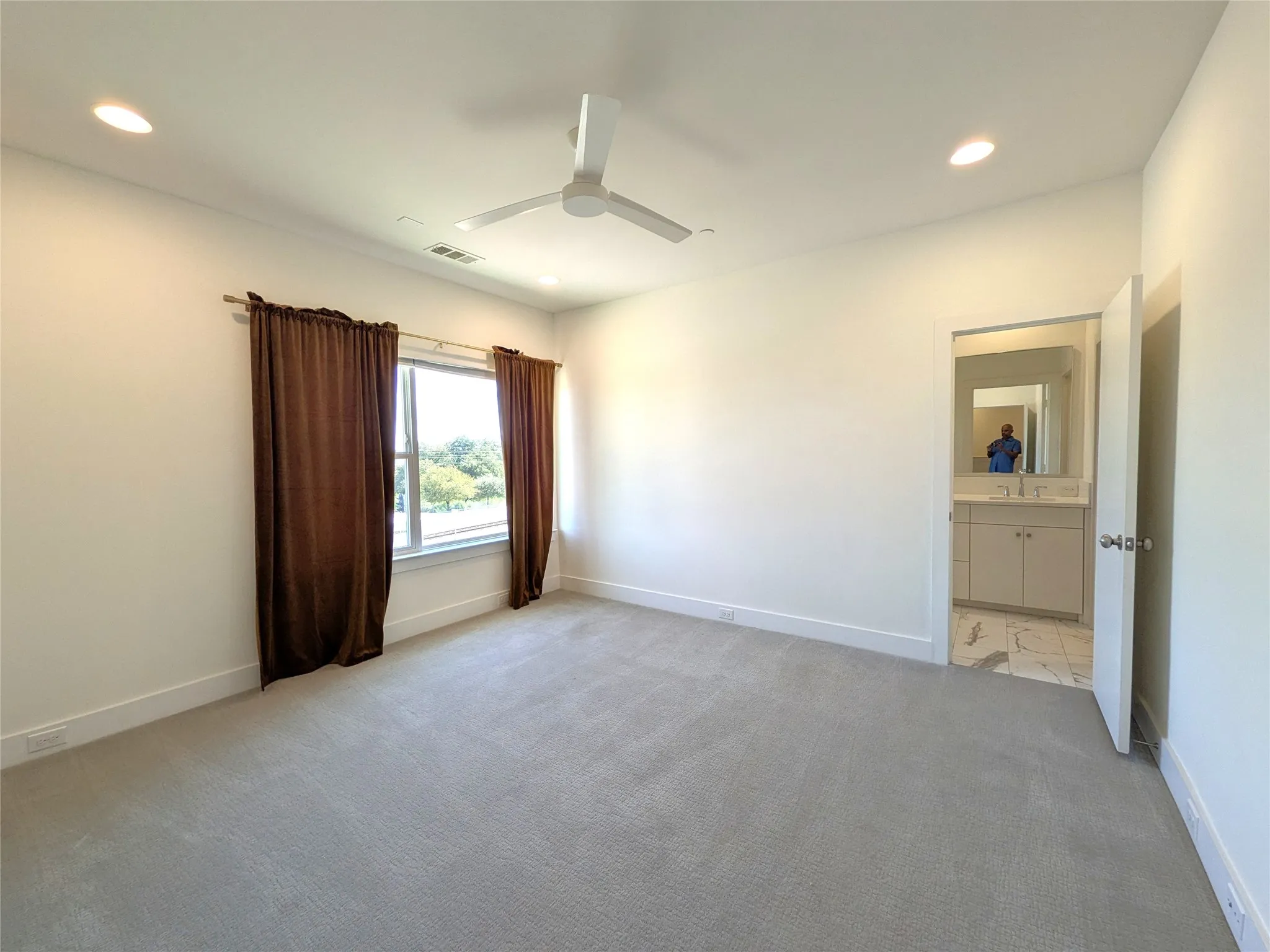 Recessed lighting, ceiling fan, and carpeted flooring