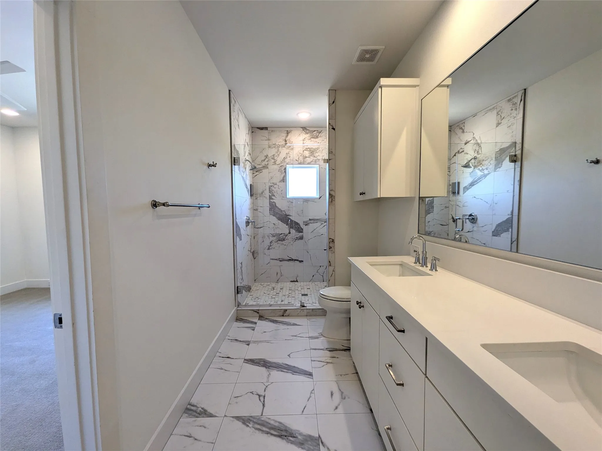 Dual vanity with integrated sinks and white countertops