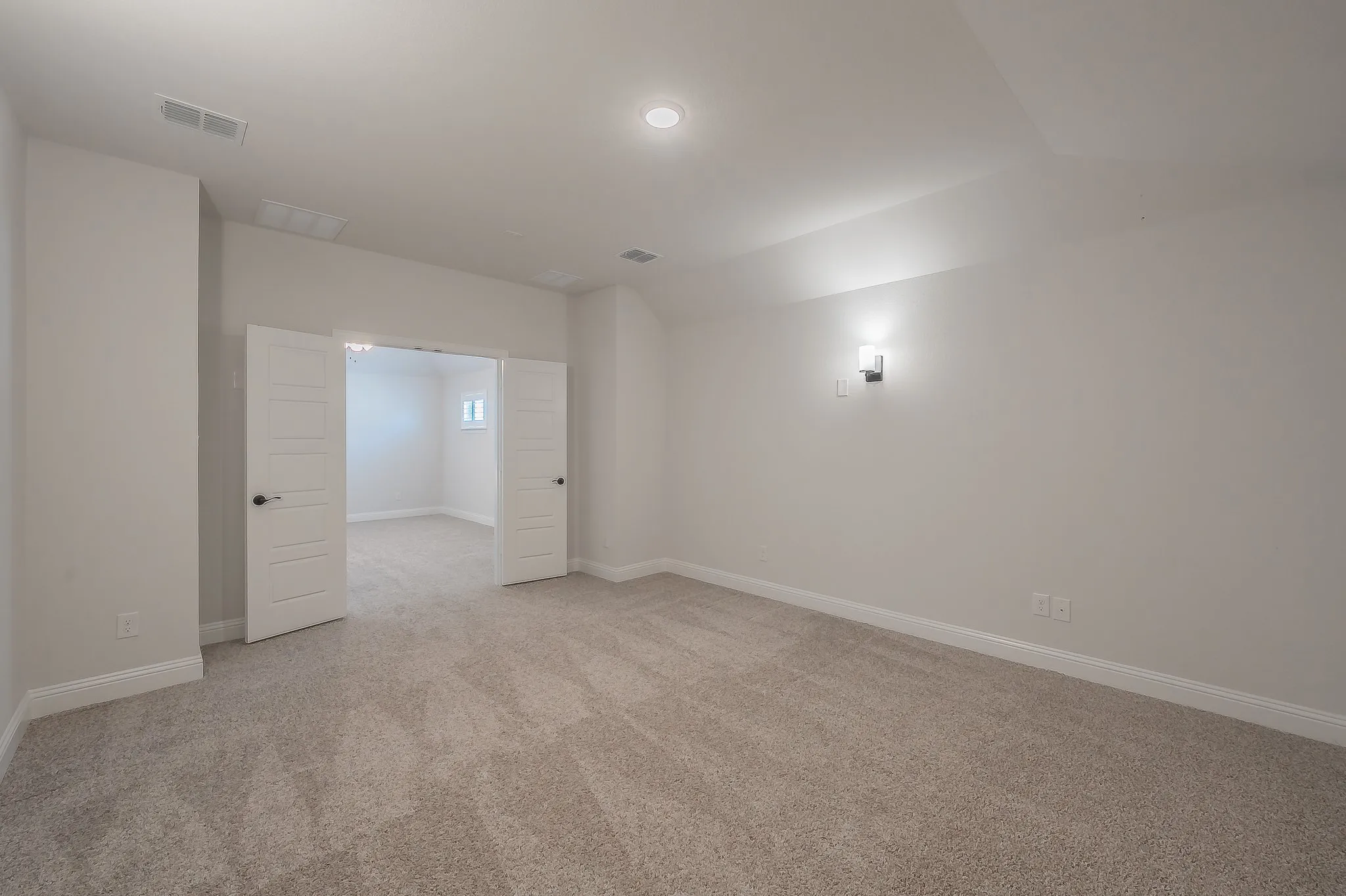 Media with Recessed lighting, wall sconce, and carpeted flooring