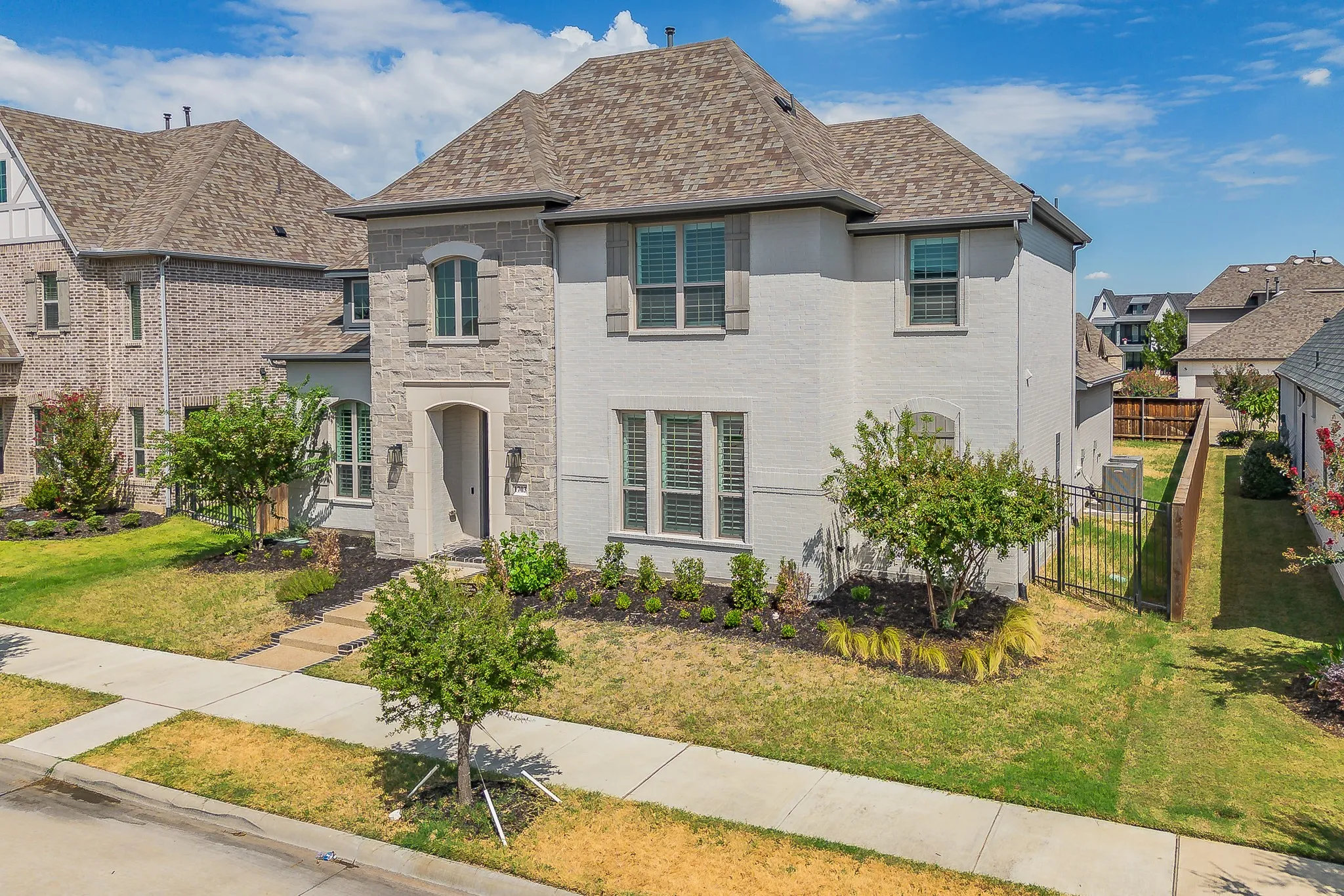 Stone and brick exterior with multiple gables