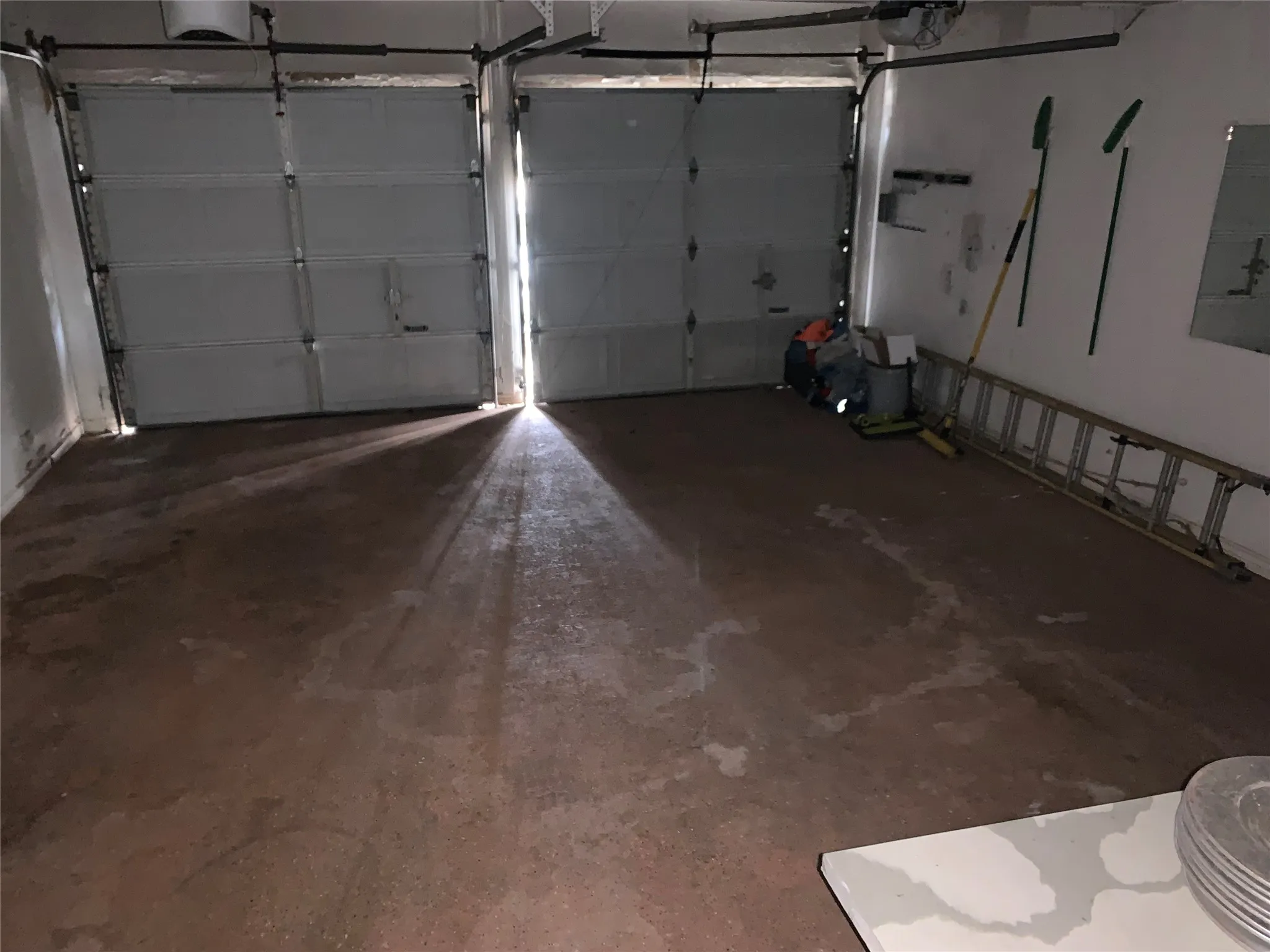 Garage with a garage door opener and electric panel