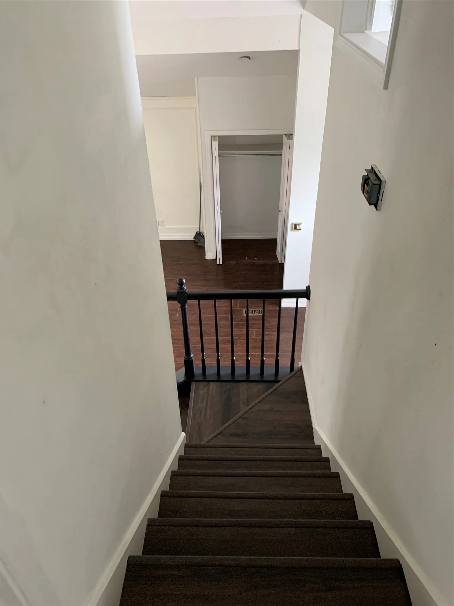 Stairway featuring wood-type flooring