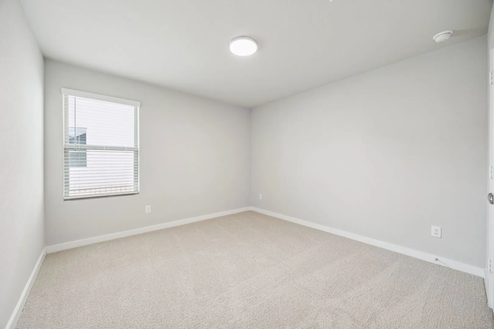 Bedroom in the Hayden home plan by Trophy Signature Homes – REPRESENTATIVE PHOTO