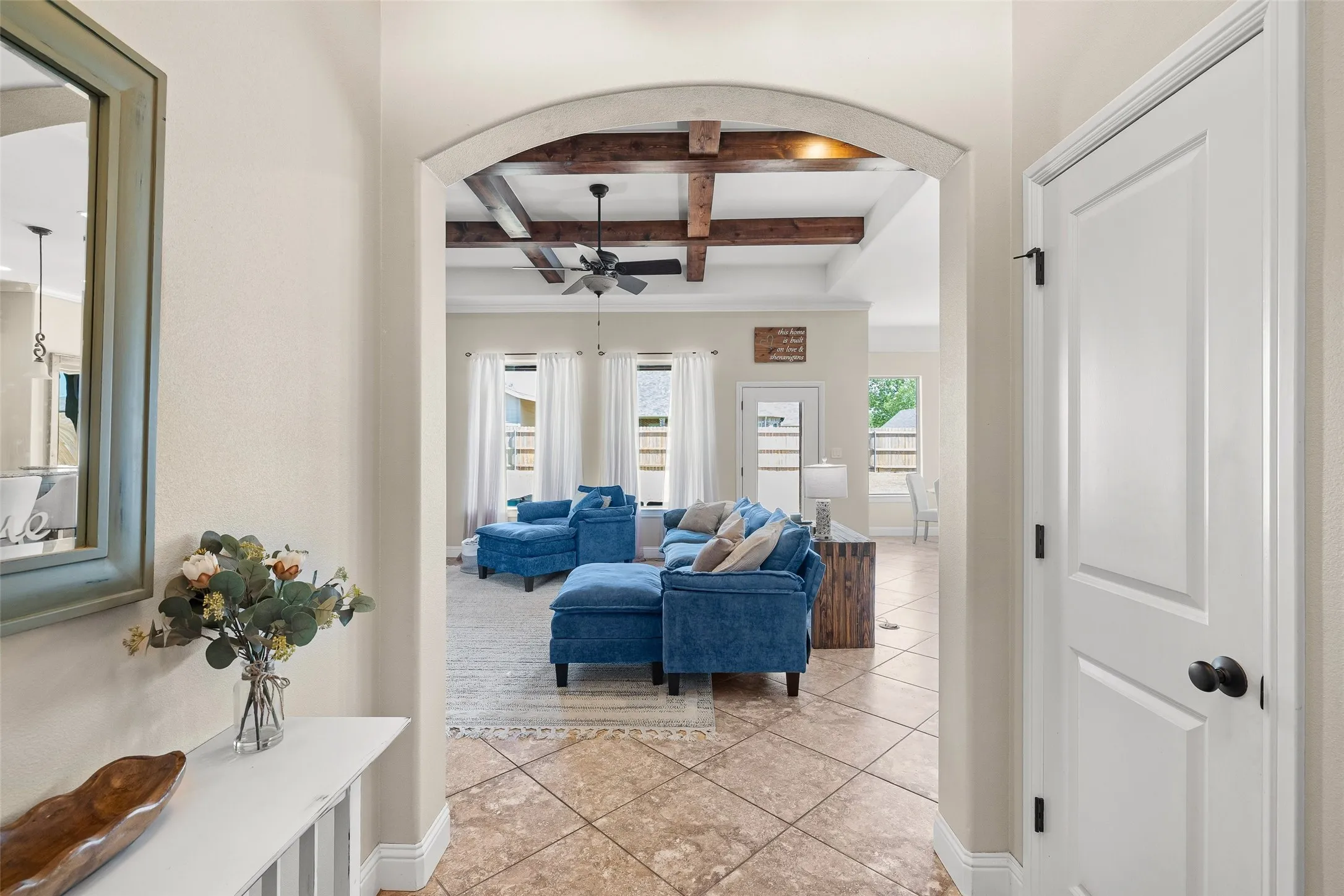 Arched entryway with tile flooring