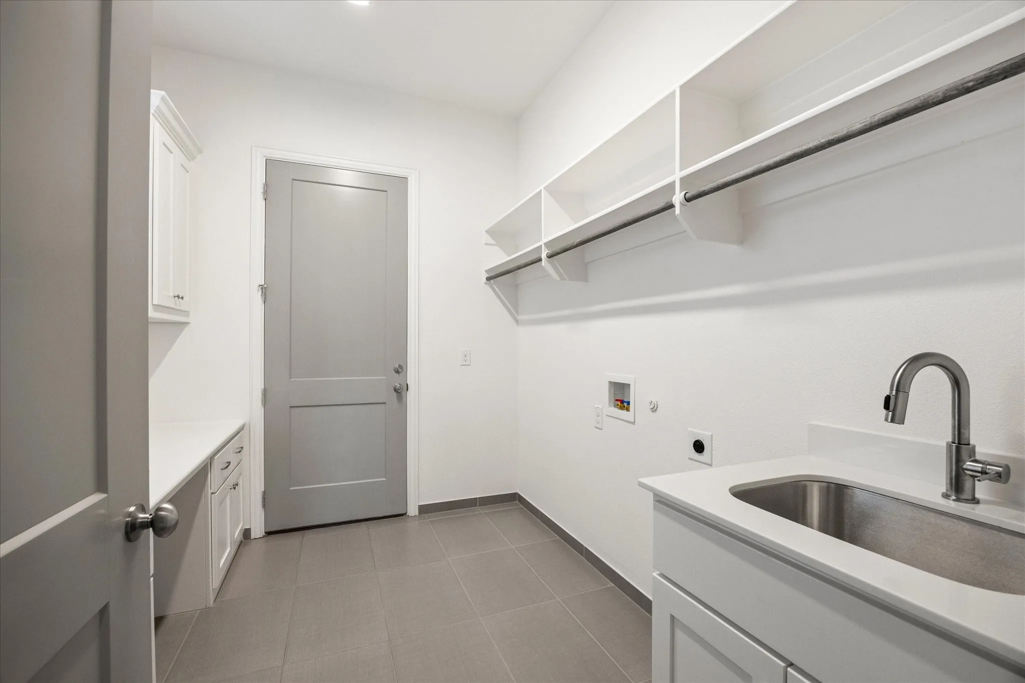 Integrated utility sink with a gooseneck faucet