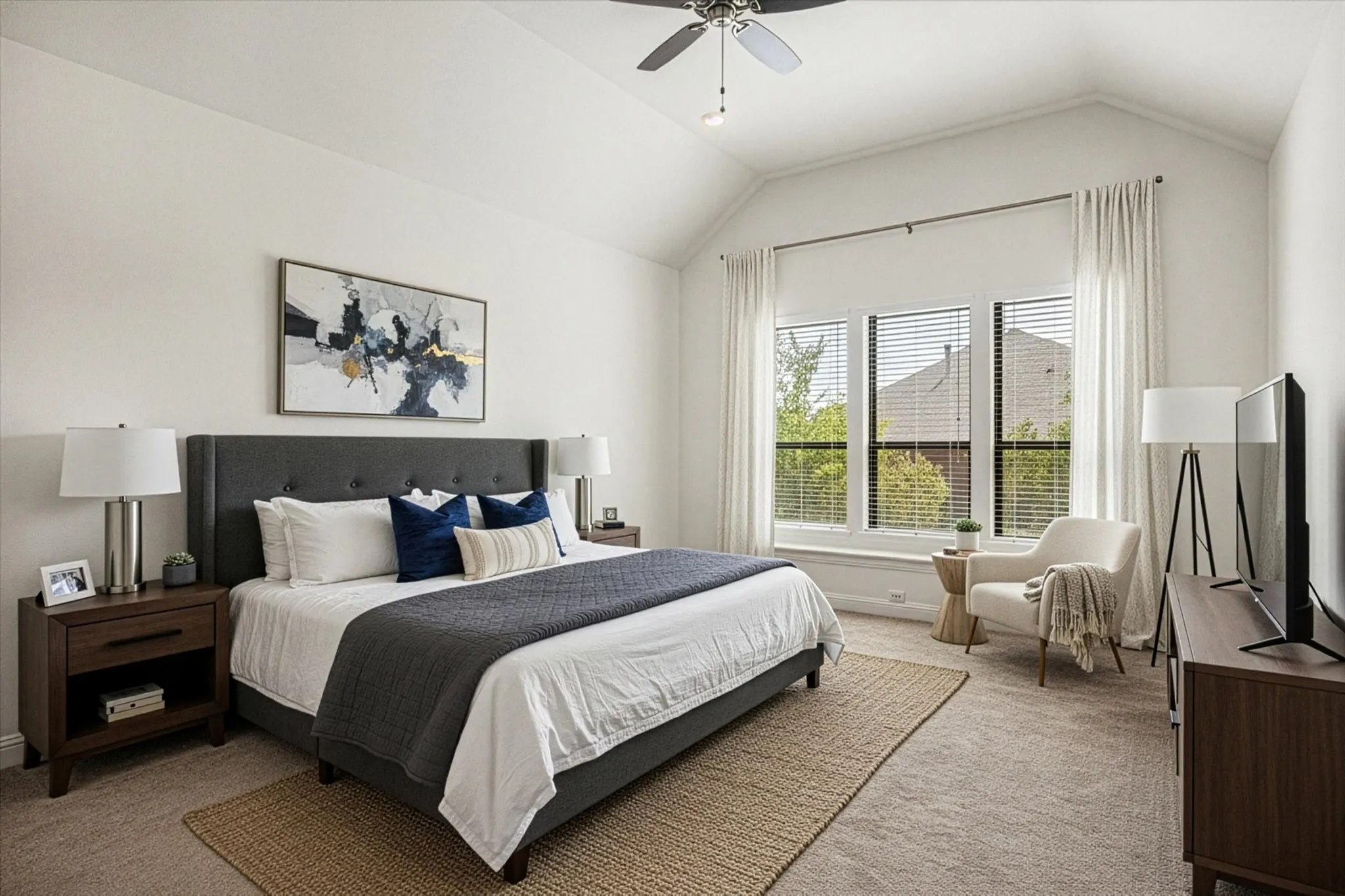 Virtual staging Vaulted ceiling with a ceiling fan, broad windows with blinds and drapes, and plush carpet flooring