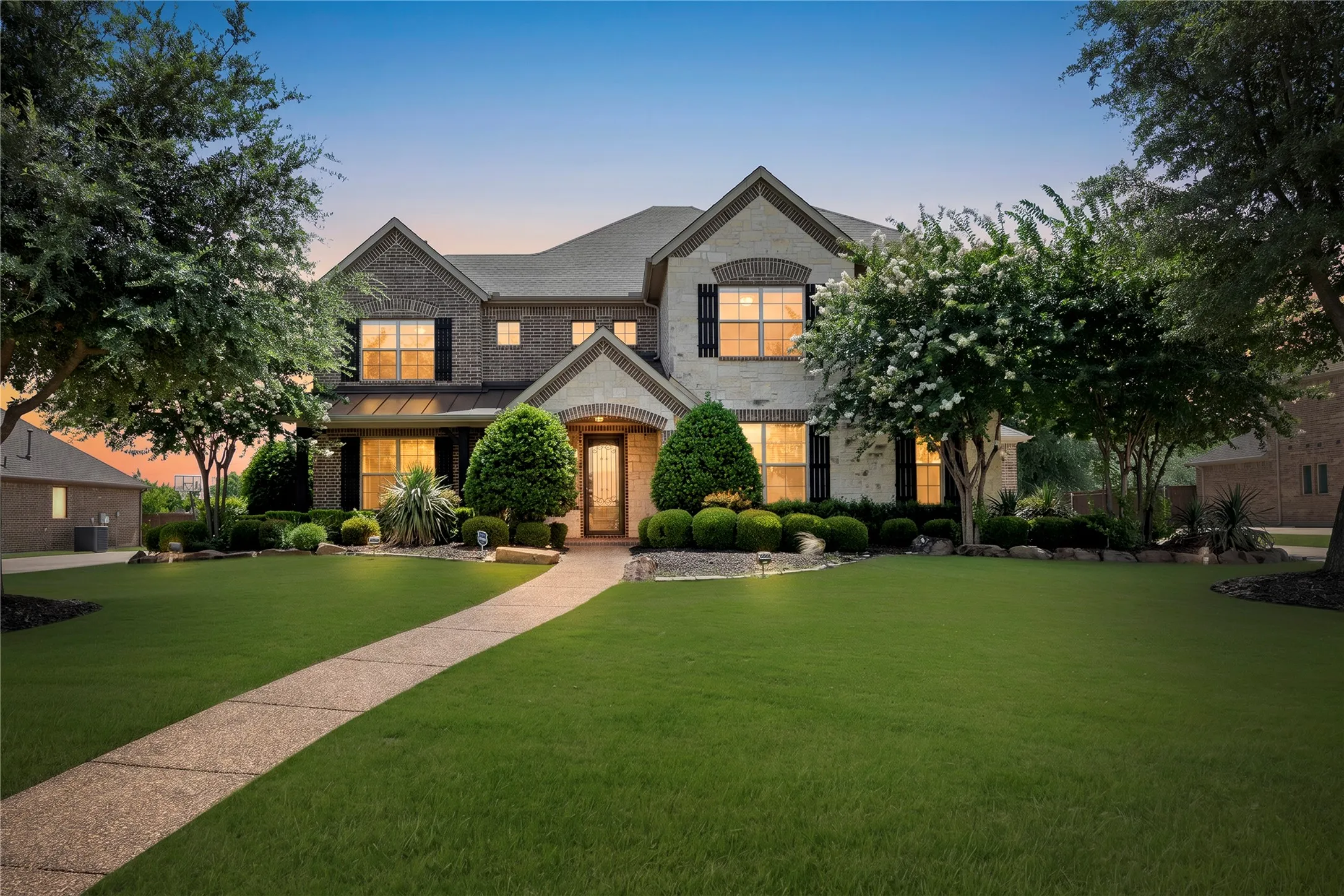 Brick and stone exterior with dark shutters