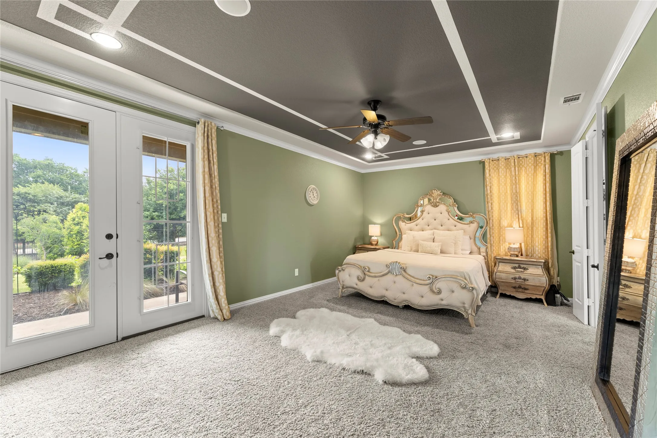 Dual French doors opening to an exterior patio