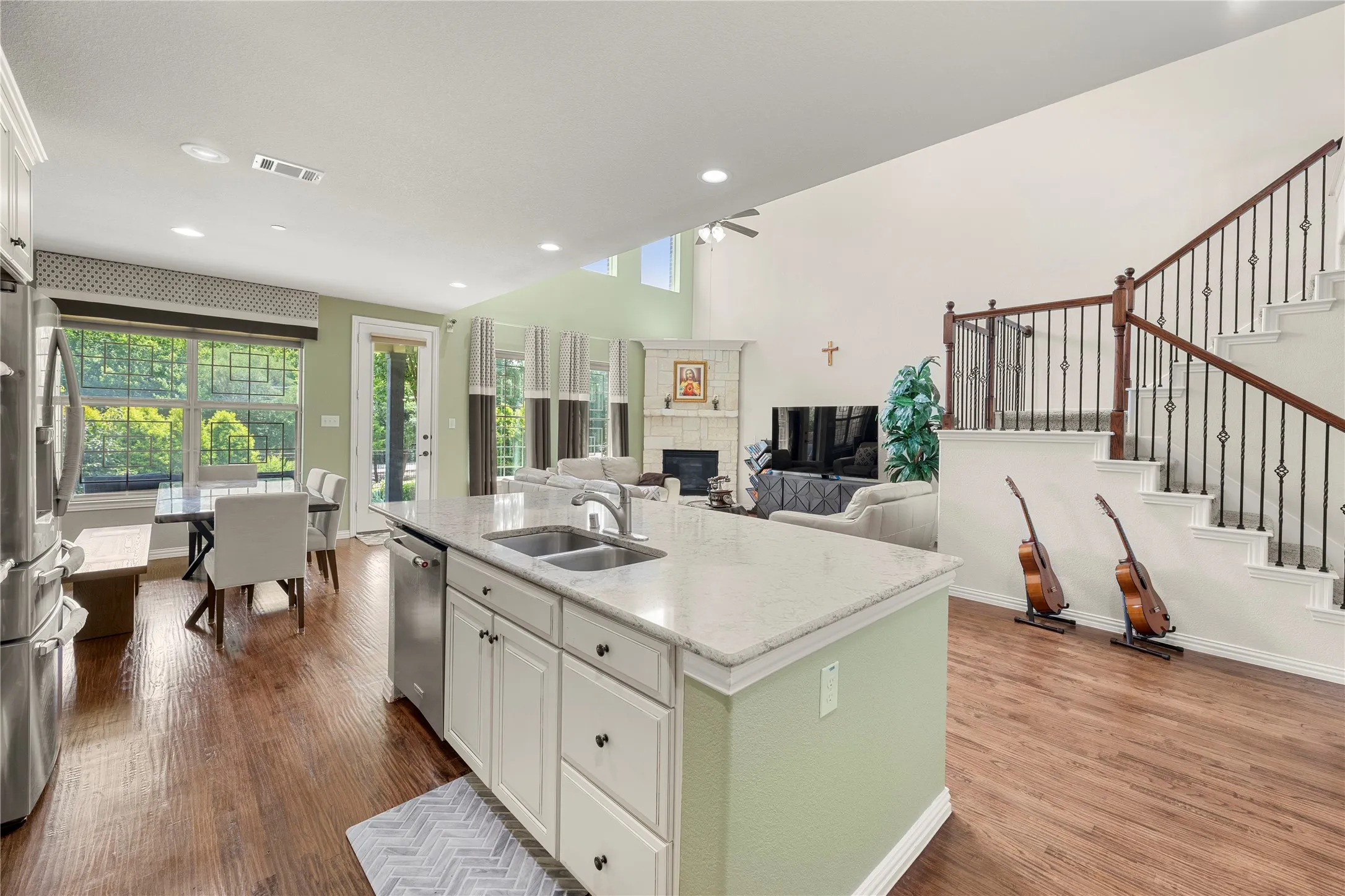 Kitchen island with an undermount double sink and light-toned countertop