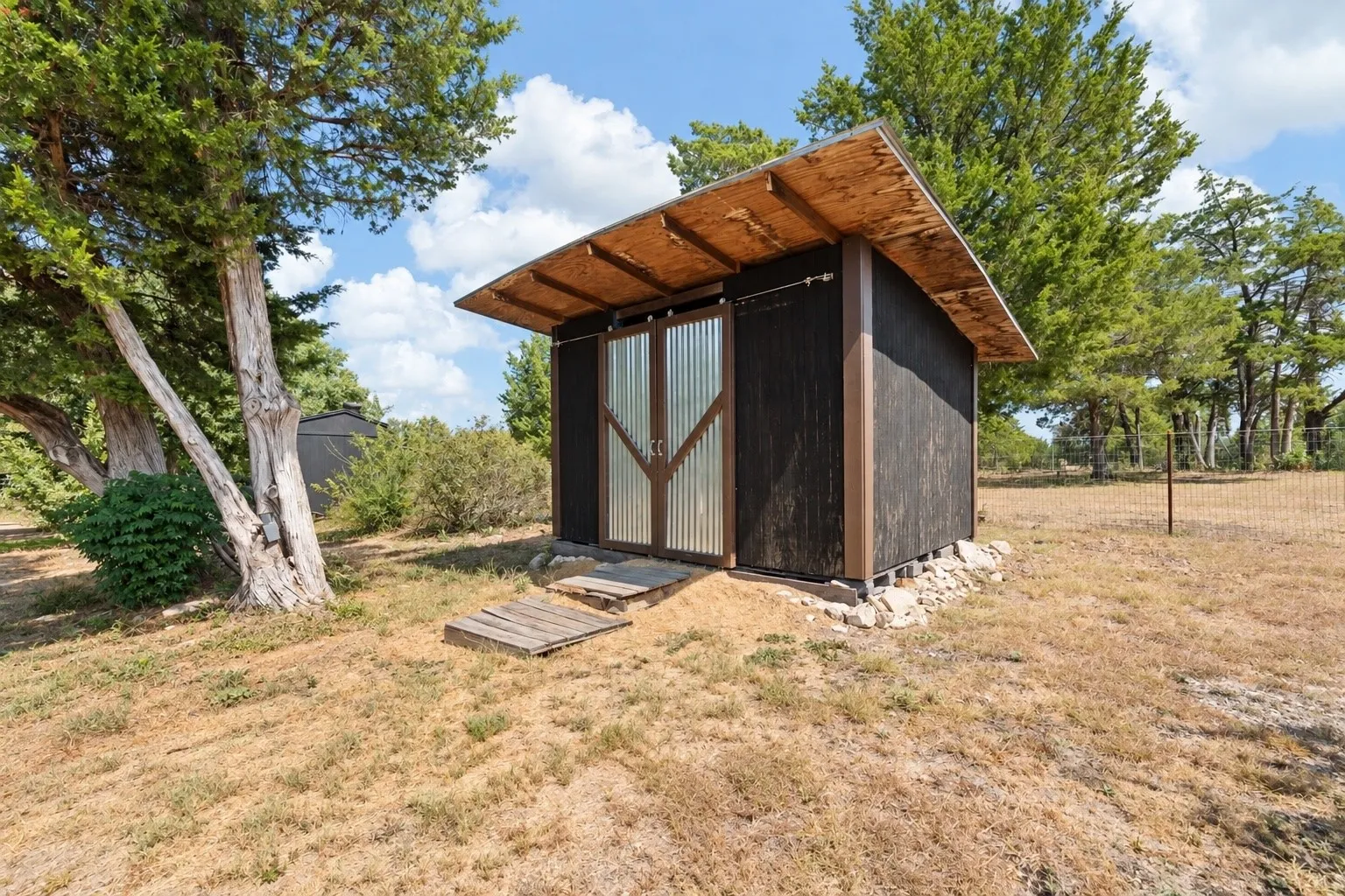 One of the several outbuildings on the property, this one is currently being used for HAY STORAGE!