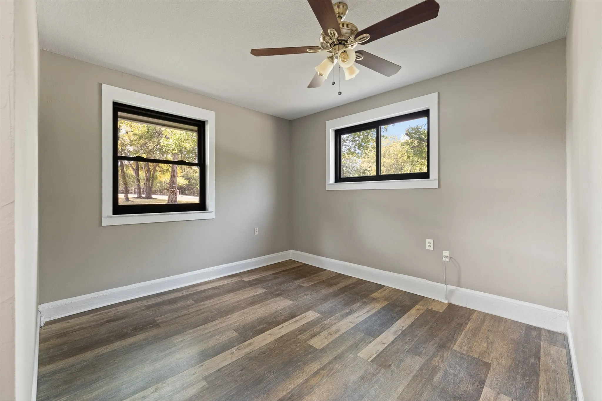 A separate space within the bonus room. This could be the perfect PLAY ROOM, GYM, or CRAFT AREA!! Already equipped with natural light and a ceiling fan!