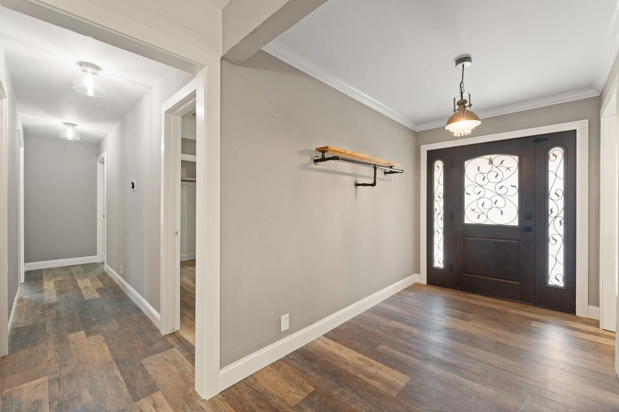 On the other side of the home, the bedrooms are pictured on the left side, and the is a kitchen entrance on the right side.