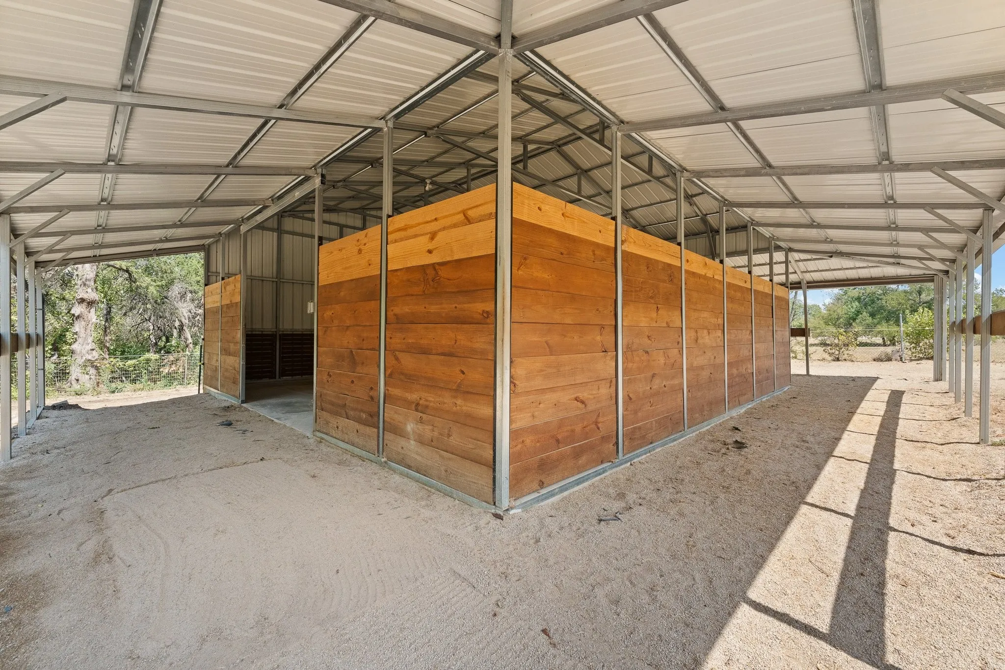 Room on the outside to add extra covered stalls, runs, a tack room, wash rack, you name it! The possibilities are endless!