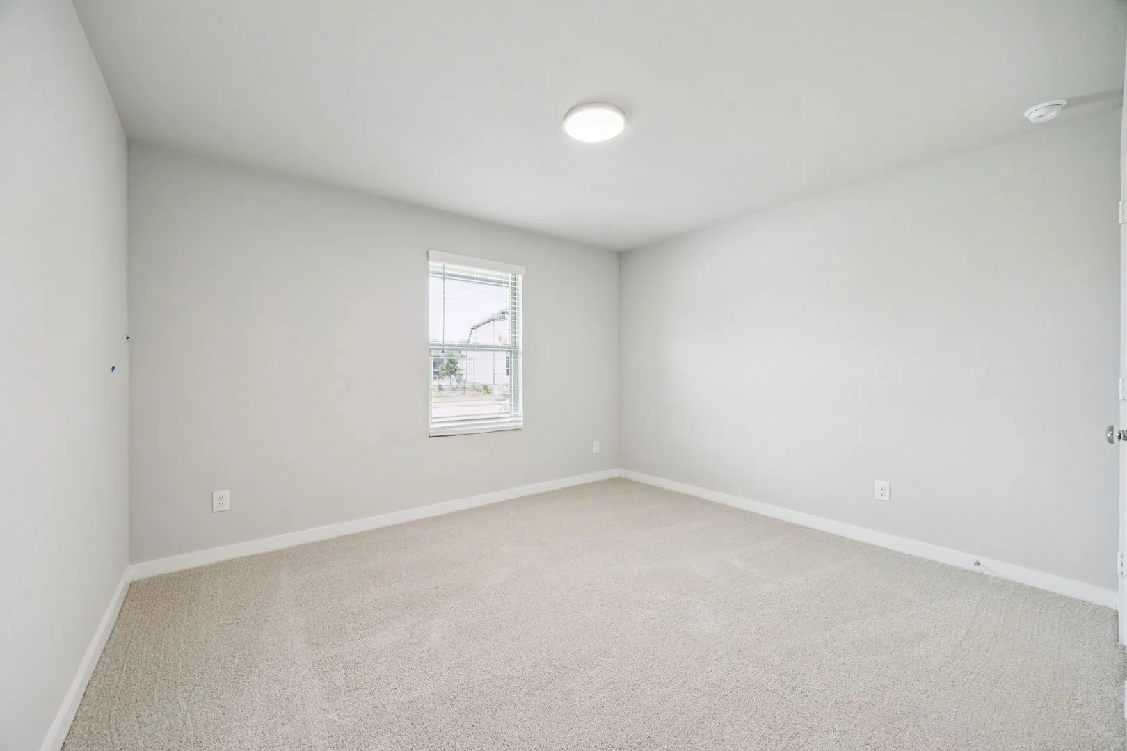 Bedroom in the Hayden home plan by Trophy Signature Homes – REPRESENTATIVE PHOTO