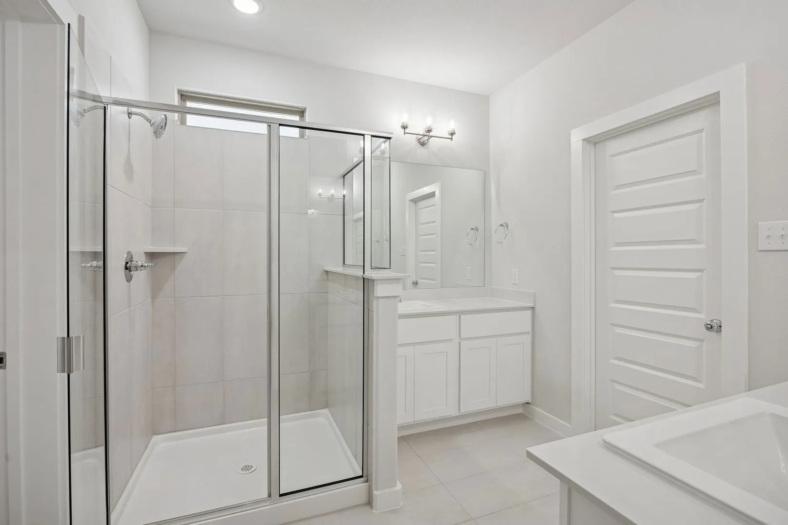 Primary Bathroom in the Masters home plan by Trophy Signature Homes – REPRESENTATIVE PHOTO