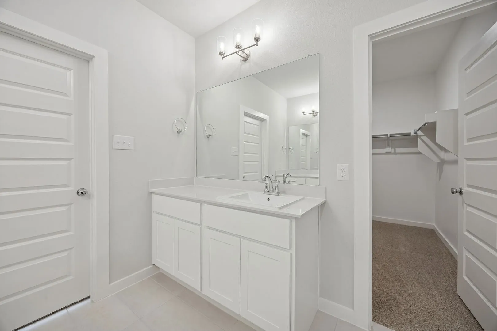 Primary Bathroom in the Masters home plan by Trophy Signature Homes – REPRESENTATIVE PHOTO