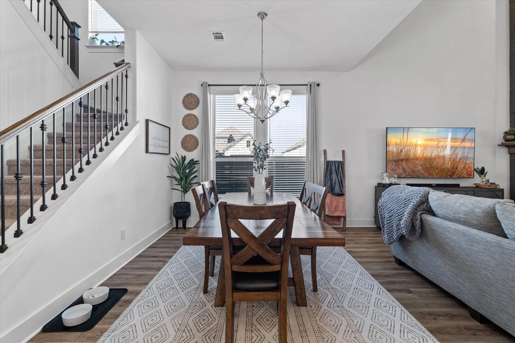 Spacious dining area with wood-finish flooring